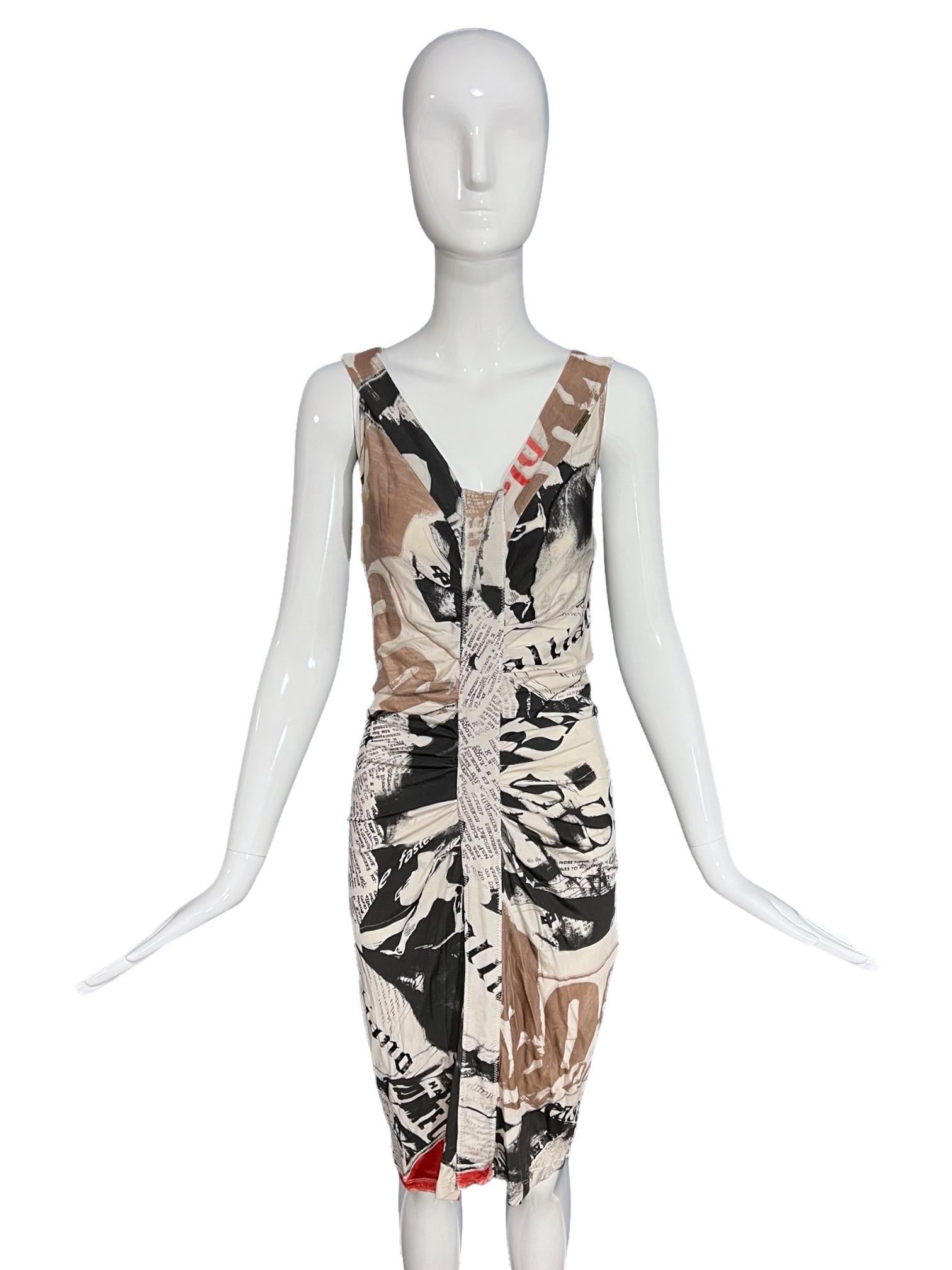 Galliano vintage gazette shirred dress in the epic newspaper print with colorful overlays of beige and red abstract motifs. Features a deep v-neck, shirred down the center of the front and back, and made of a stretchy knit fabric. 

Size:
