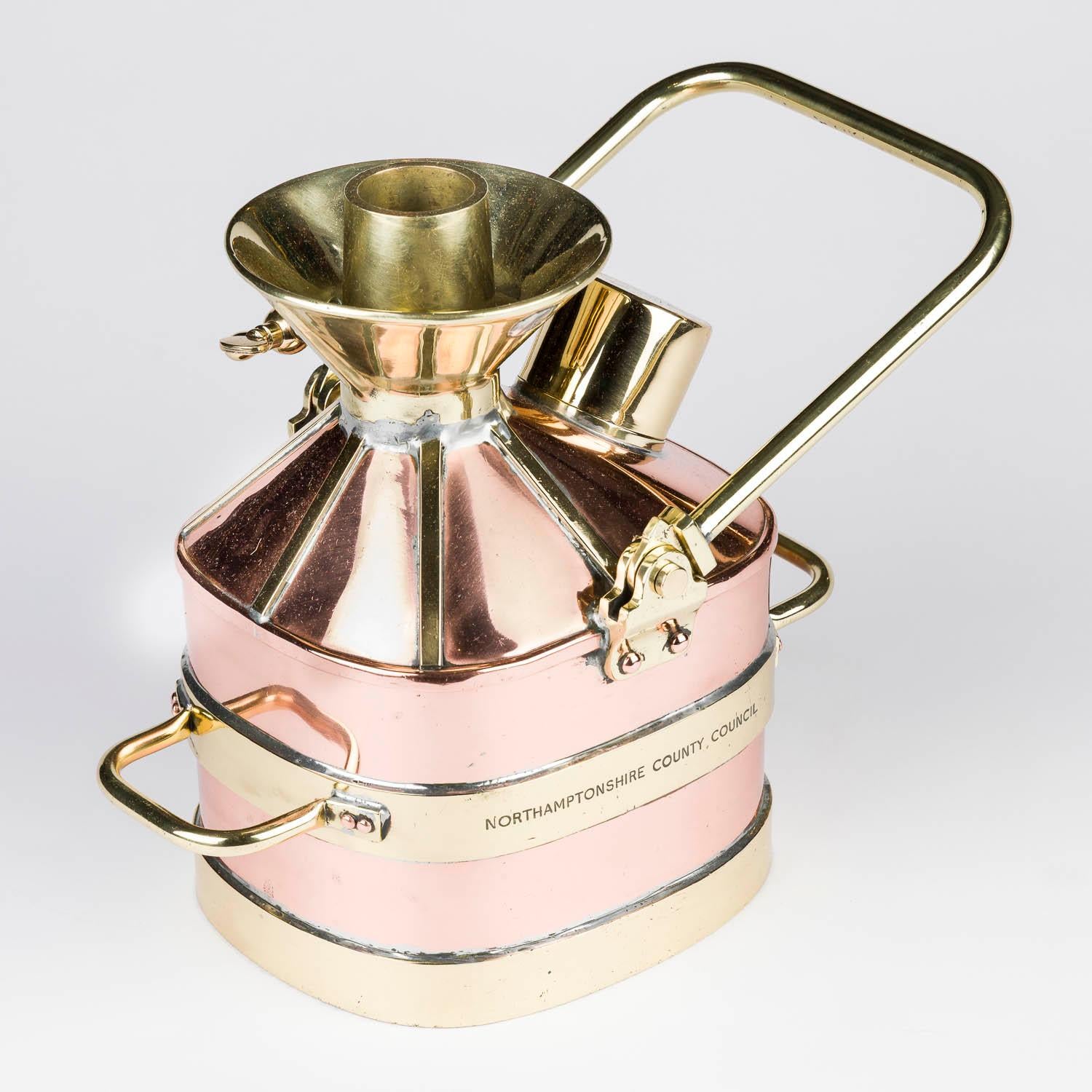 A copper and brass one gallon 