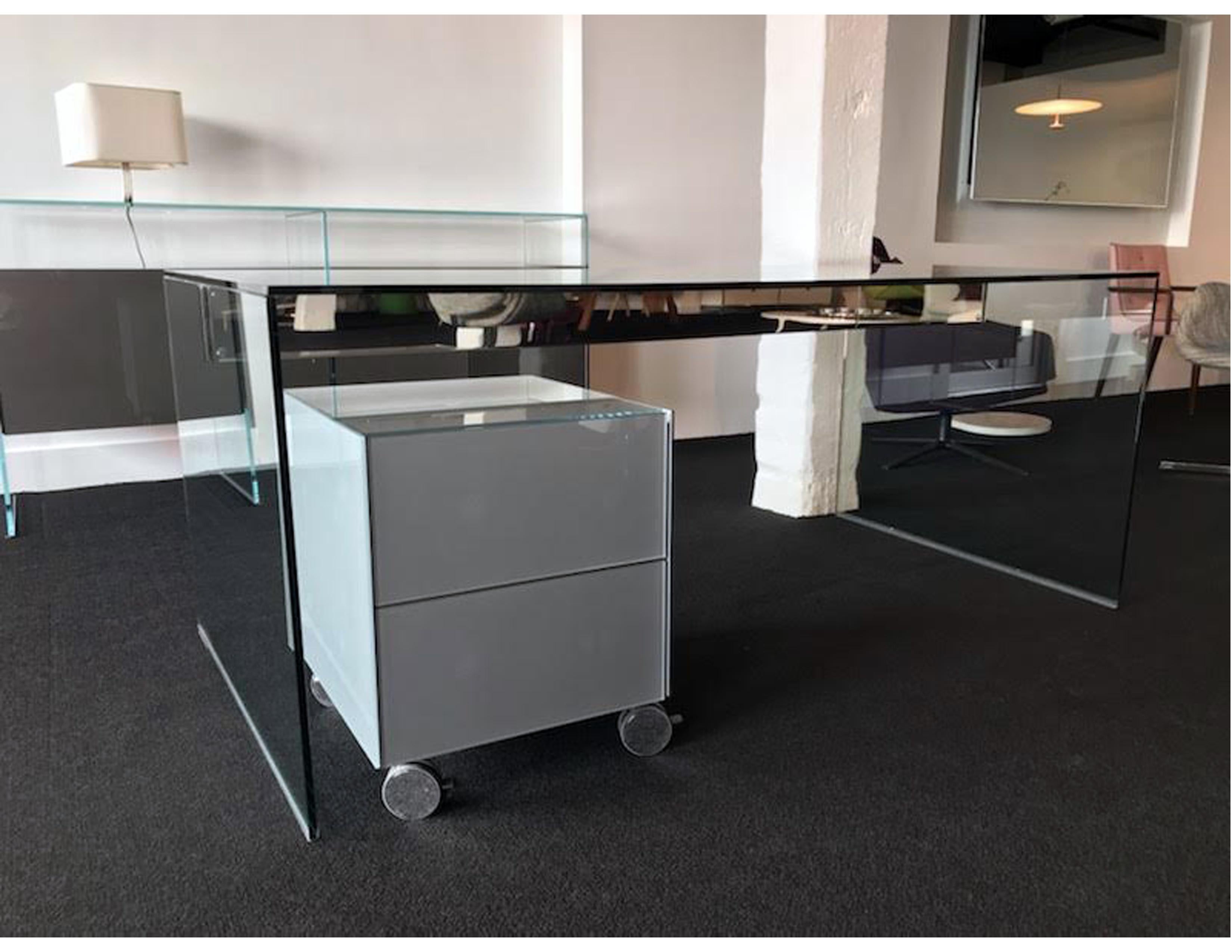 The desk is 36 x 71 x 29 1/2
Bright stainless steel structure 
Transparent glass
$4140.

 