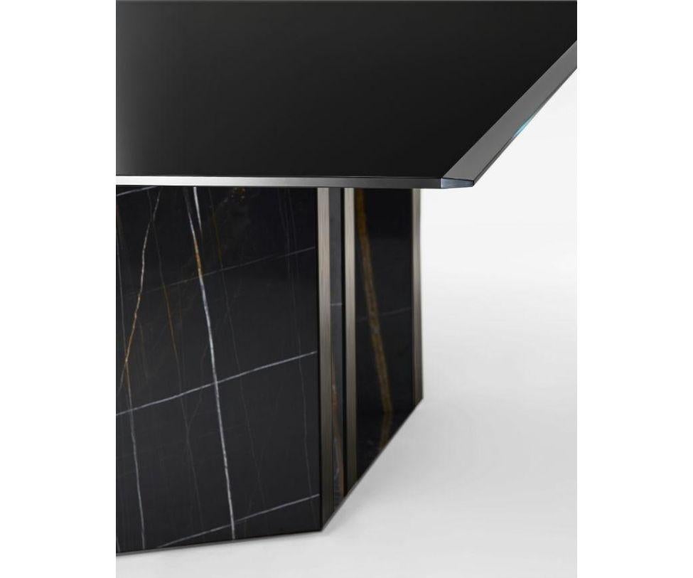 Designed by Oscar & Gabriele Buratti

Table with black stained brushed ash top and Sahara Noir marble base. 