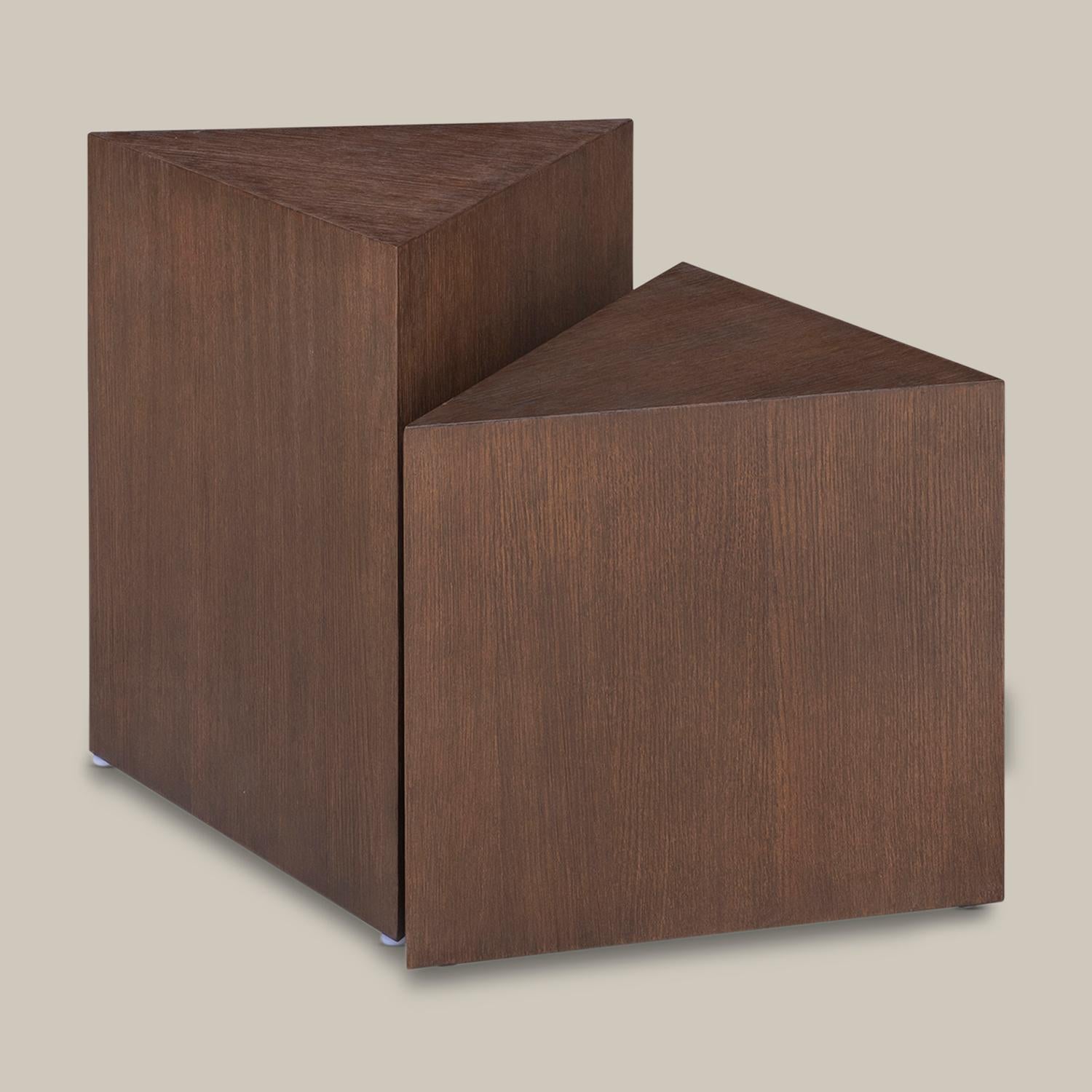 This solid wood triangular design reinterprets the tradition of sculpture as an artful side table. Handmade by artisans in Vietnam, this modern, functional piece is beautiful on its own or grouped with the Arago and Appell.

