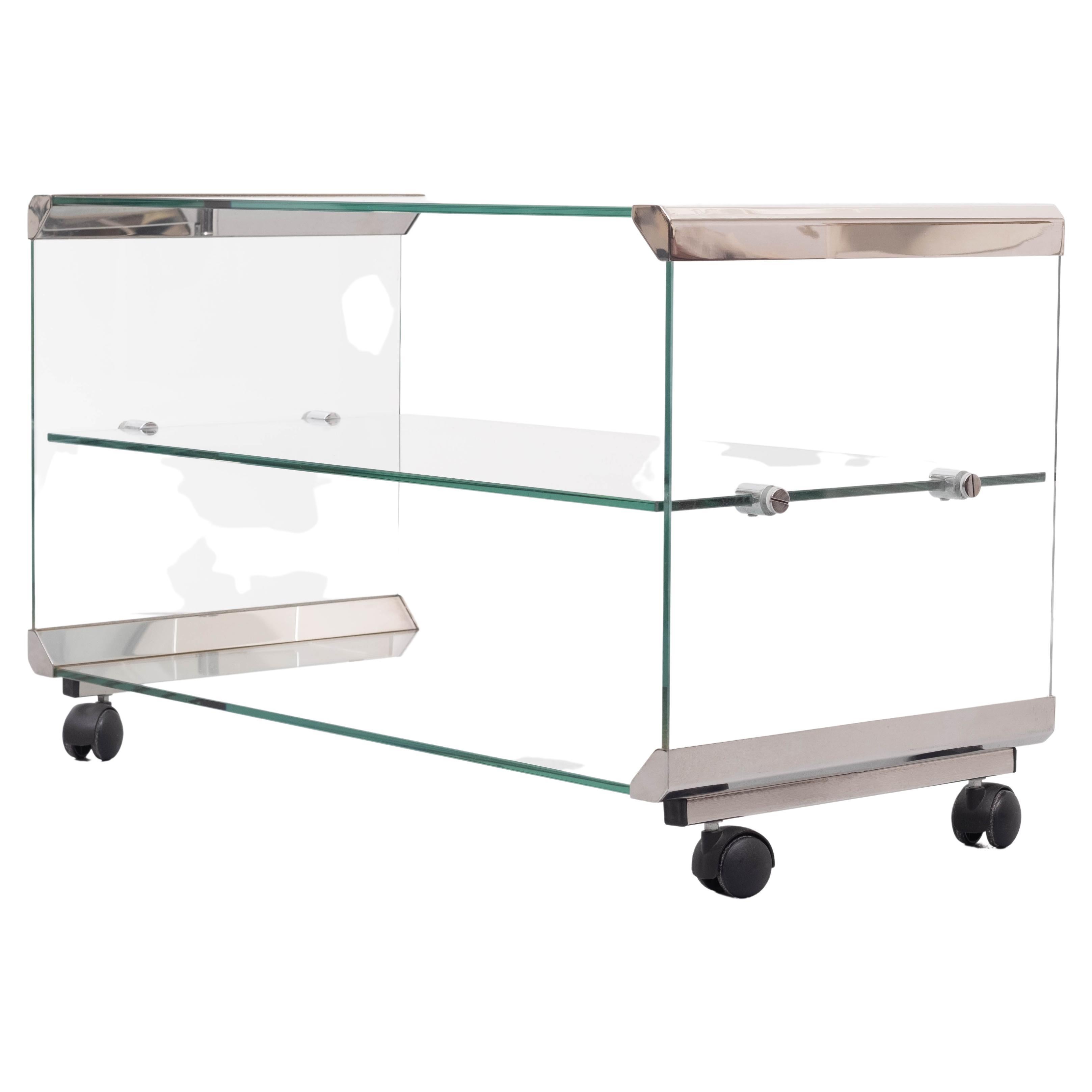 A beautiful glass trolley by Galloti & Radice from Italy. Made in the 1970s, this lovely table on black wheels is made of high quality clear glass. The grey metal edges are used as connections and adds a luxurious style to the piece that allows it