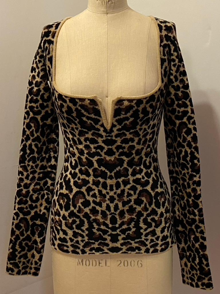    Galvan (London) wonderfully rich and cozy leopard print pullover features a deep 'Princess