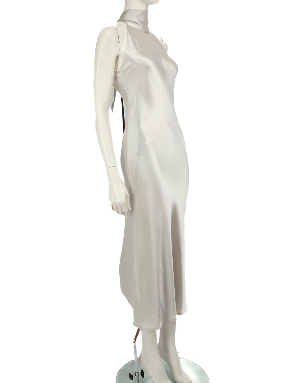 CONDITION is Very good. Hardly any visible wear to dress is evident. However, due to poor storage, there is a mark on the rear bottom right and pulls to weave on front left on this Galvan London designer resale item. This item comes with an original