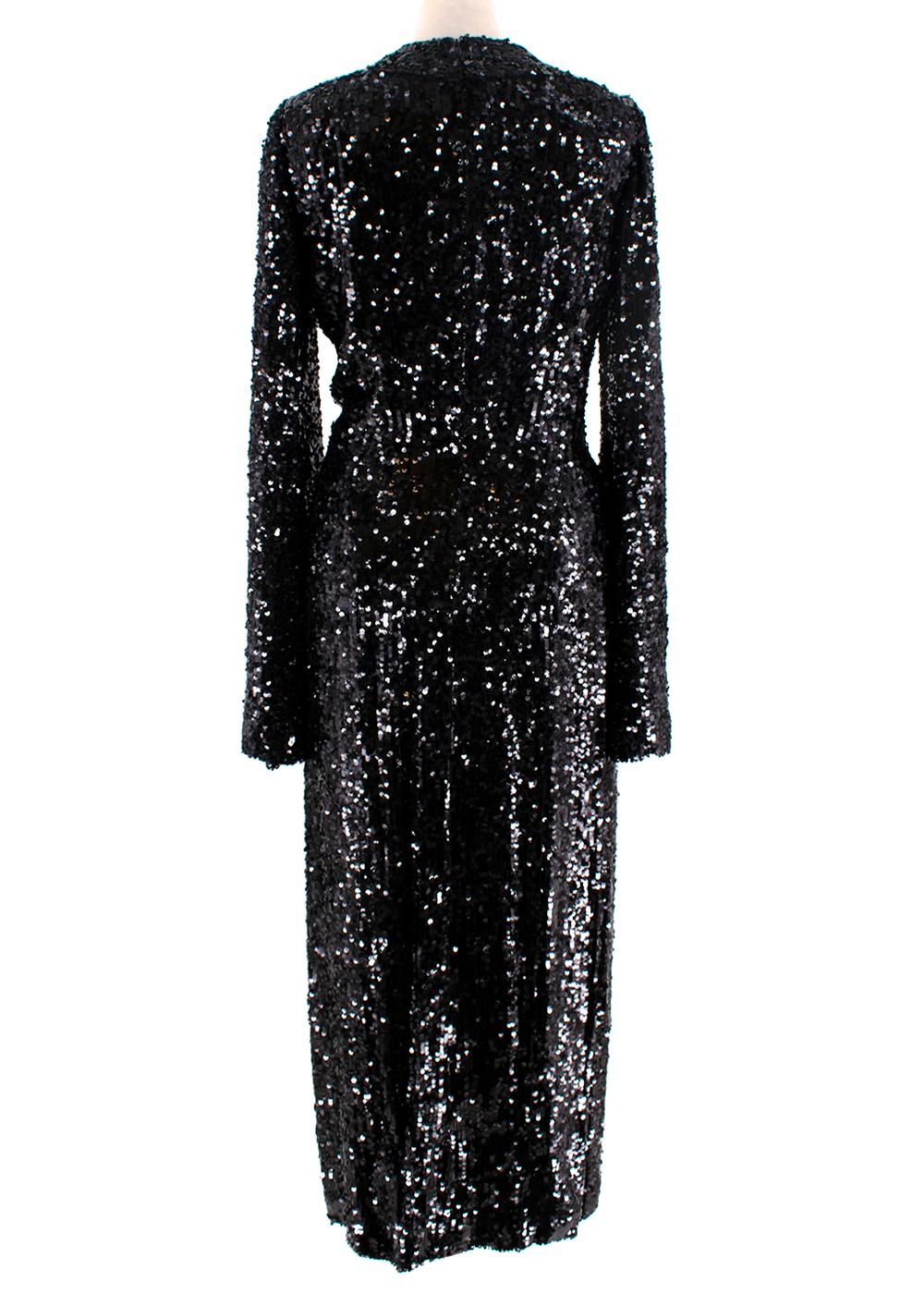 Galvan Moonlight Schwarzes Pailletten Abendkleid

- Glamouröses schwarzes Kleid mit Paillettenbesatz und tiefem V-Ausschnitt
- Lange, ausgestellte Ärmel
- Vorderseite in Wickeloptik, mit geteiltem Rockteil
- Vollständig gefüttert, verdeckter