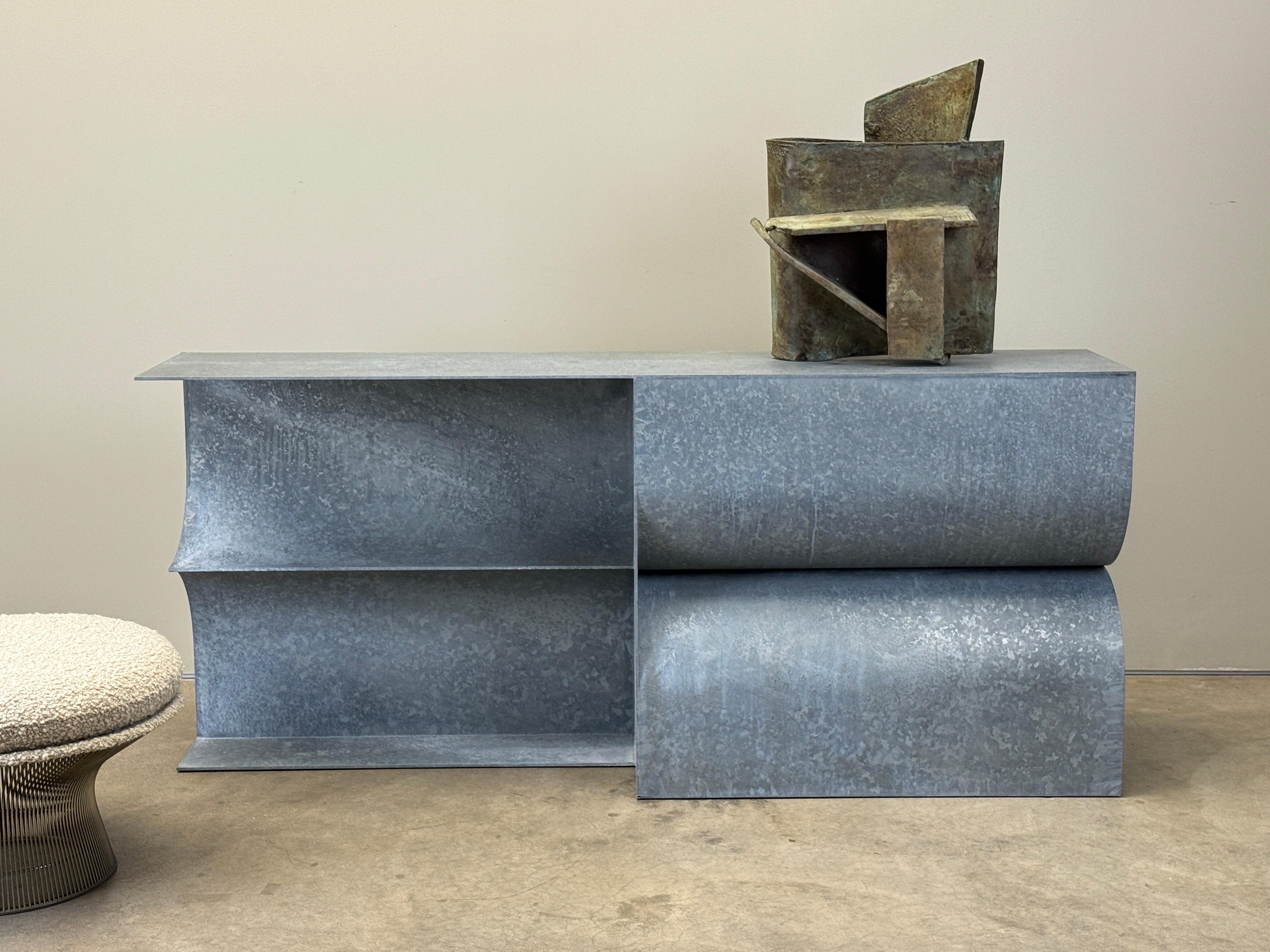 A custom hot-dipped galvanized steel 'Kelly' console with waxed finish designed by Christopher Stuart. 