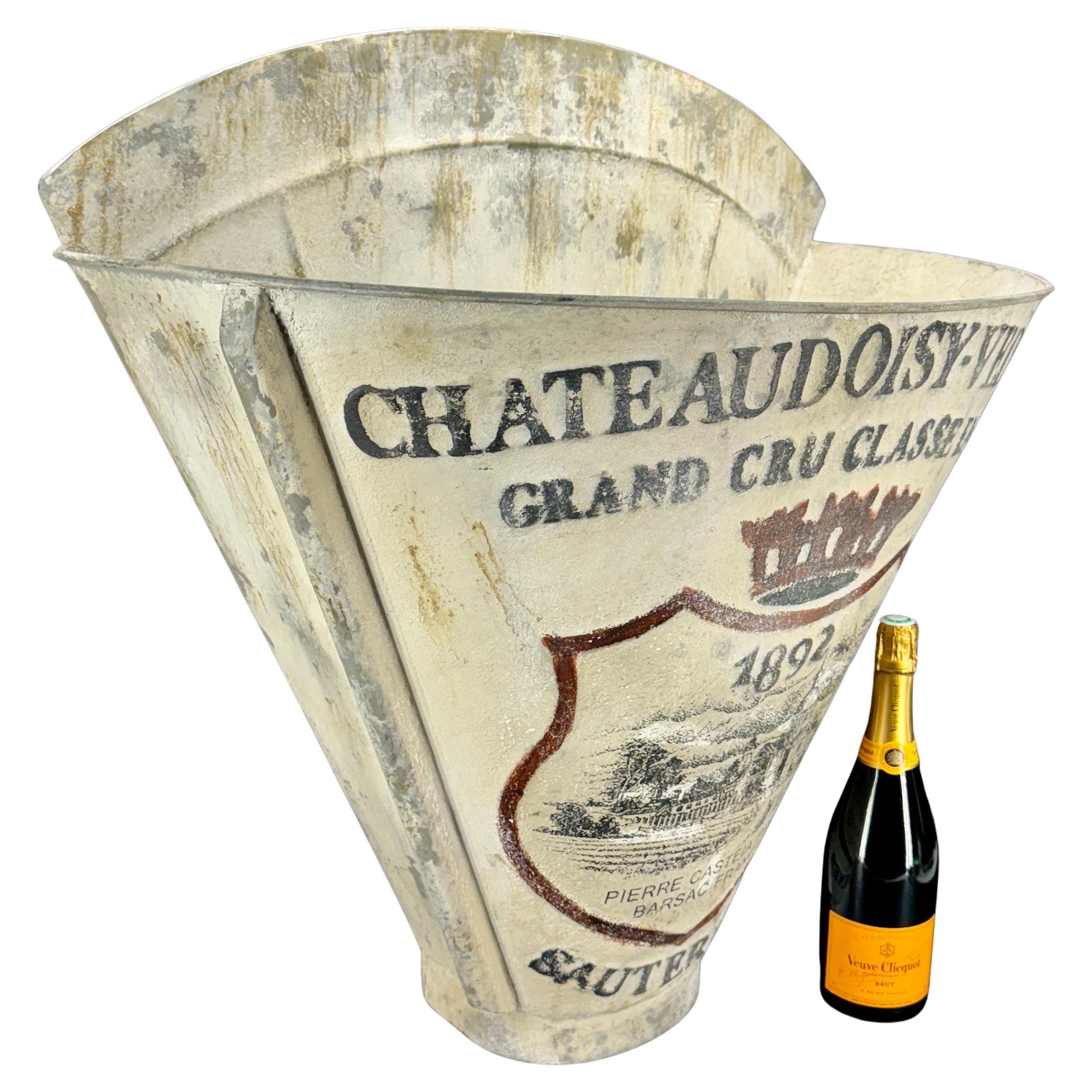 A large impressive French style metal grape harvesting basket. Original hods were used to help the workers carry them on their back allowing for ease of picking grapes. This galvanized bin has been made to look aged with a beautiful warm patina. The