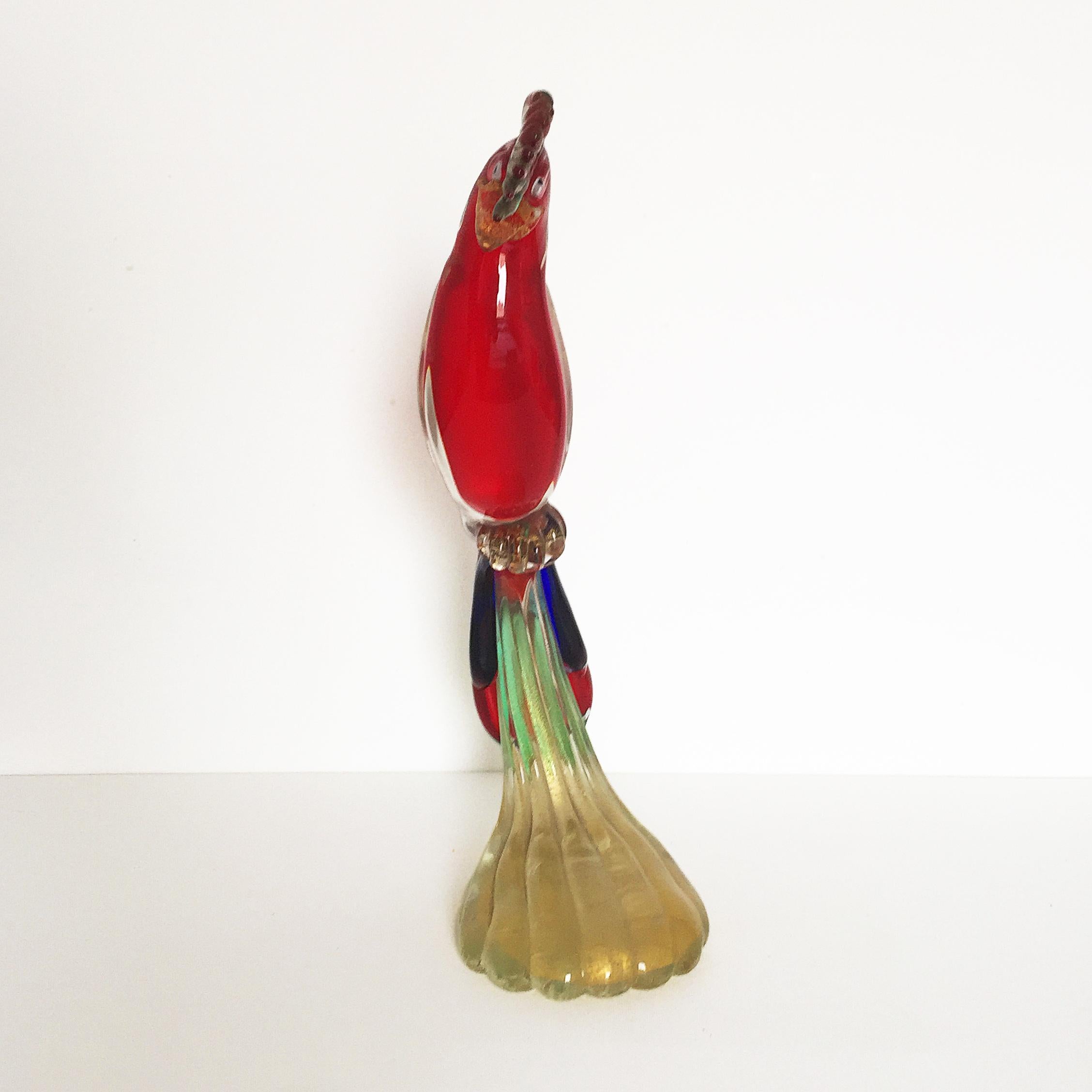Rare extra large of about 18” tall handblown Gambaro & Poggi Murano glass parrot with gold flecks and their distinctive base. Cheeky looking parrot in red, blue, green, clear and gold flecks base.