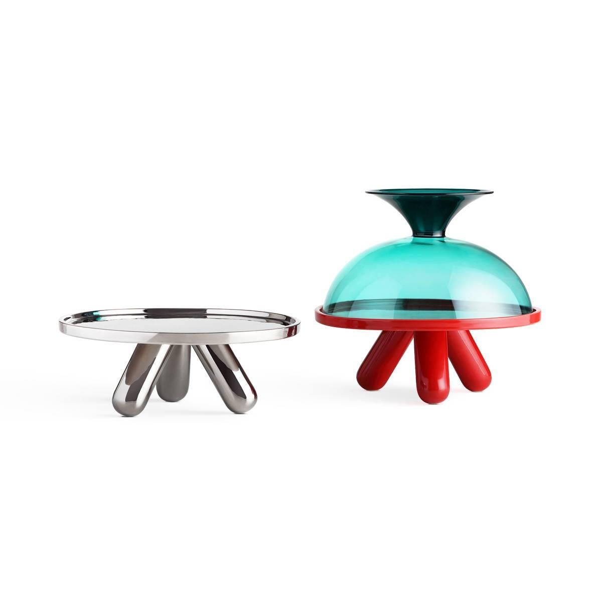 Gambone is a large ceramic riser with platinum finish designed by Aldo Cibic. The product is part of Table Joy collection: an upbeat, vividly colored and ever so slightly radical family of tableware that can be reassembled as desired, mixing colors,