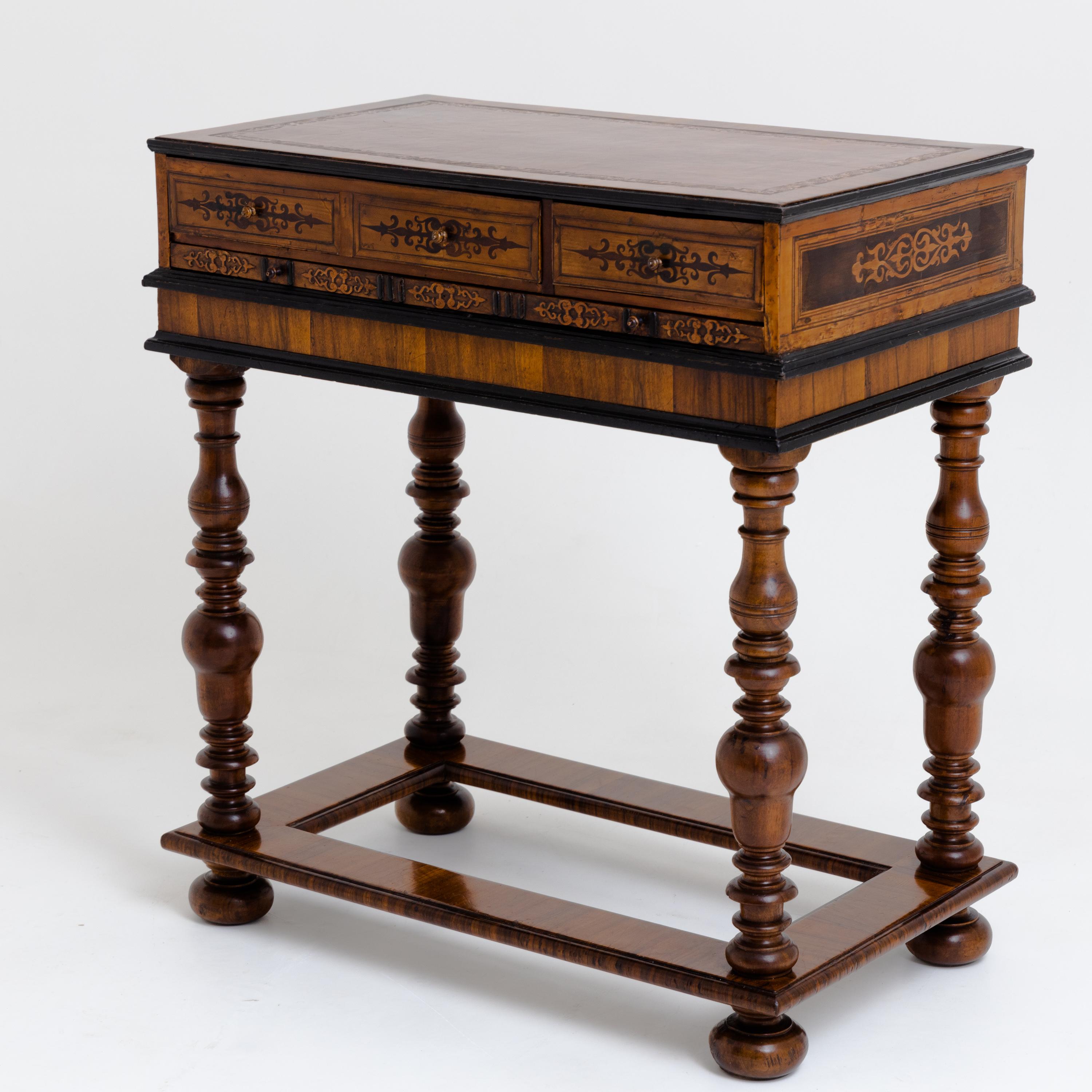 Renaissance game table with extendable boards, including chess, Nine Men's Morris and backgammon, as well as a small drawing desk with an adjustable writing surface, which is decorated with inlays. The base with baluster legs is secondary.