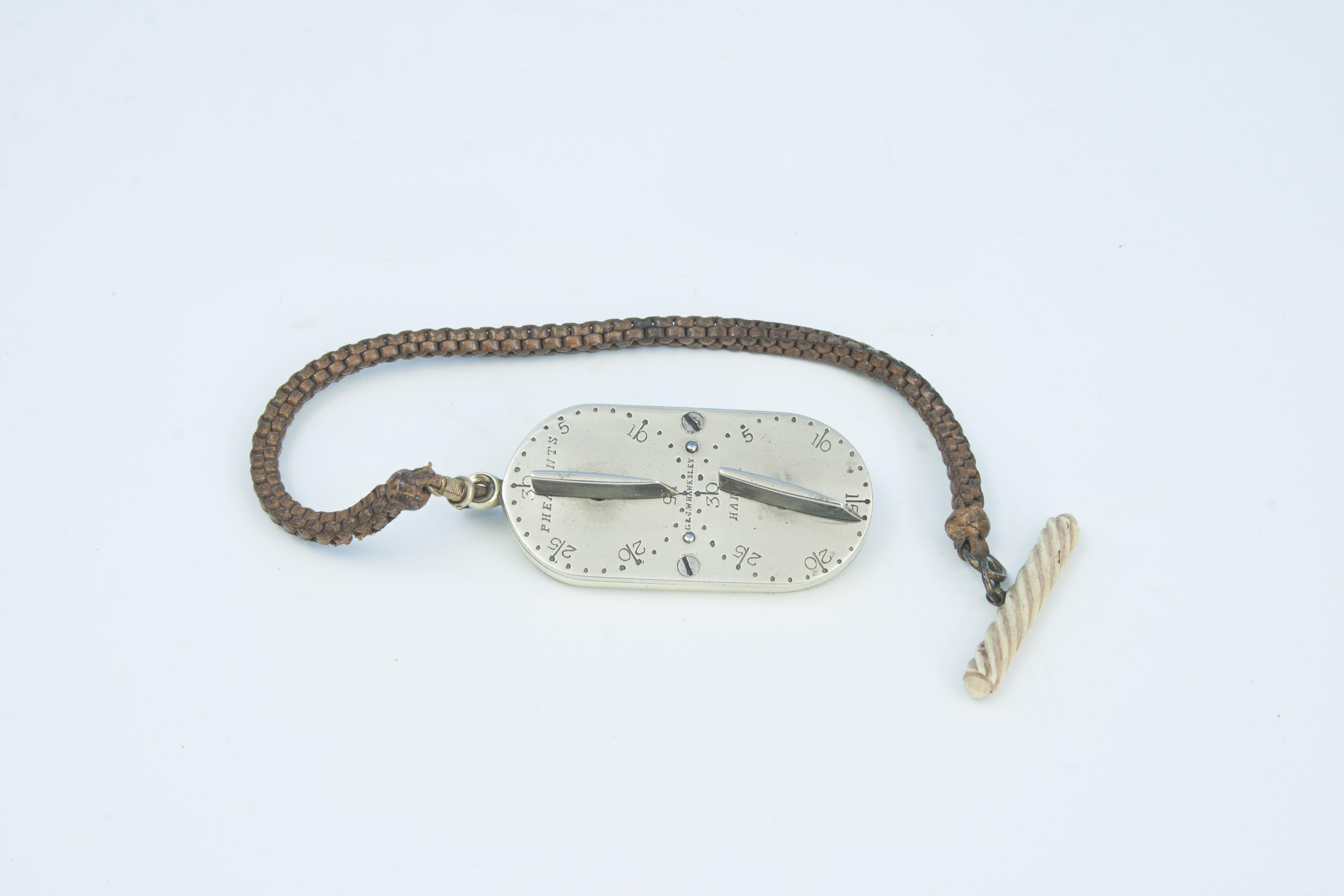 G & J.W Hawksley Norfolk Liar Game Counter.
A pocket size four dial game counter made and marketed by G & J W Hawksley, silversmiths of Sheffield, England. The main body and one side made of brass, the other side being nickel silver. The brass side