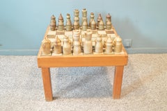 Game of Chess with His Table