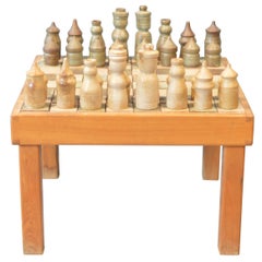 Game of Chess with His Table