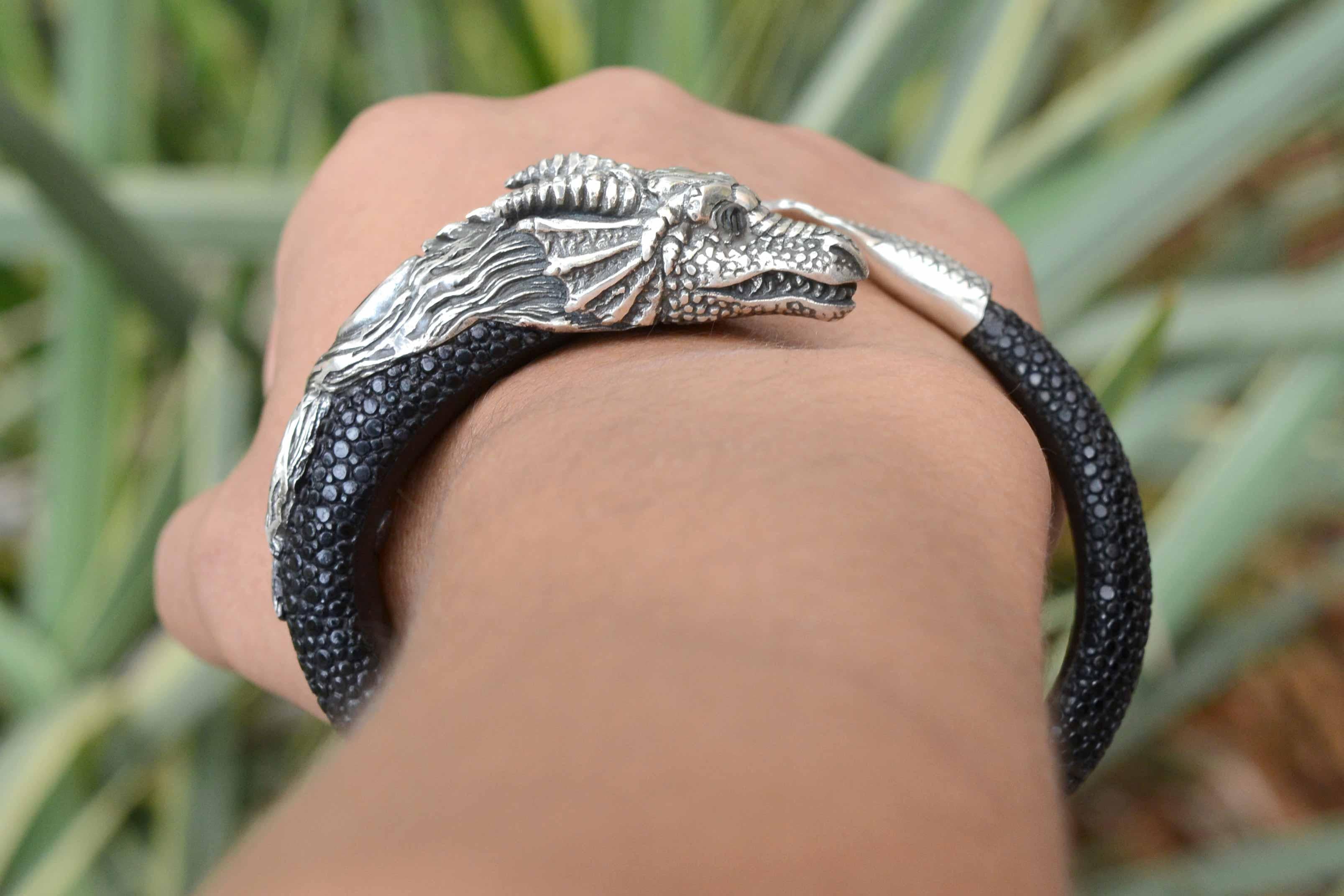 If you're a fan of Game of Thrones, you'll love this fantastic dragon bracelet. Resembling the infamous Rhaegal, Viserion or Drogon, this sterling silver arm cuff bangle is wrapped in exotic, sustainable stingray shagreen and has that GOT Medieval,