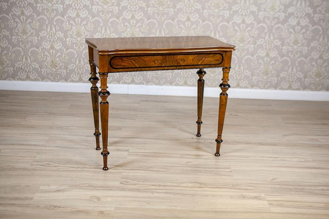 Game Table From the Late 19th Century With Hidden Drawer

Gaming table, also serving as a wall table, dating back to the end of the 19th century. Furniture composed of two parts that unfold by sliding, and a top connected by hinges. Base in the form