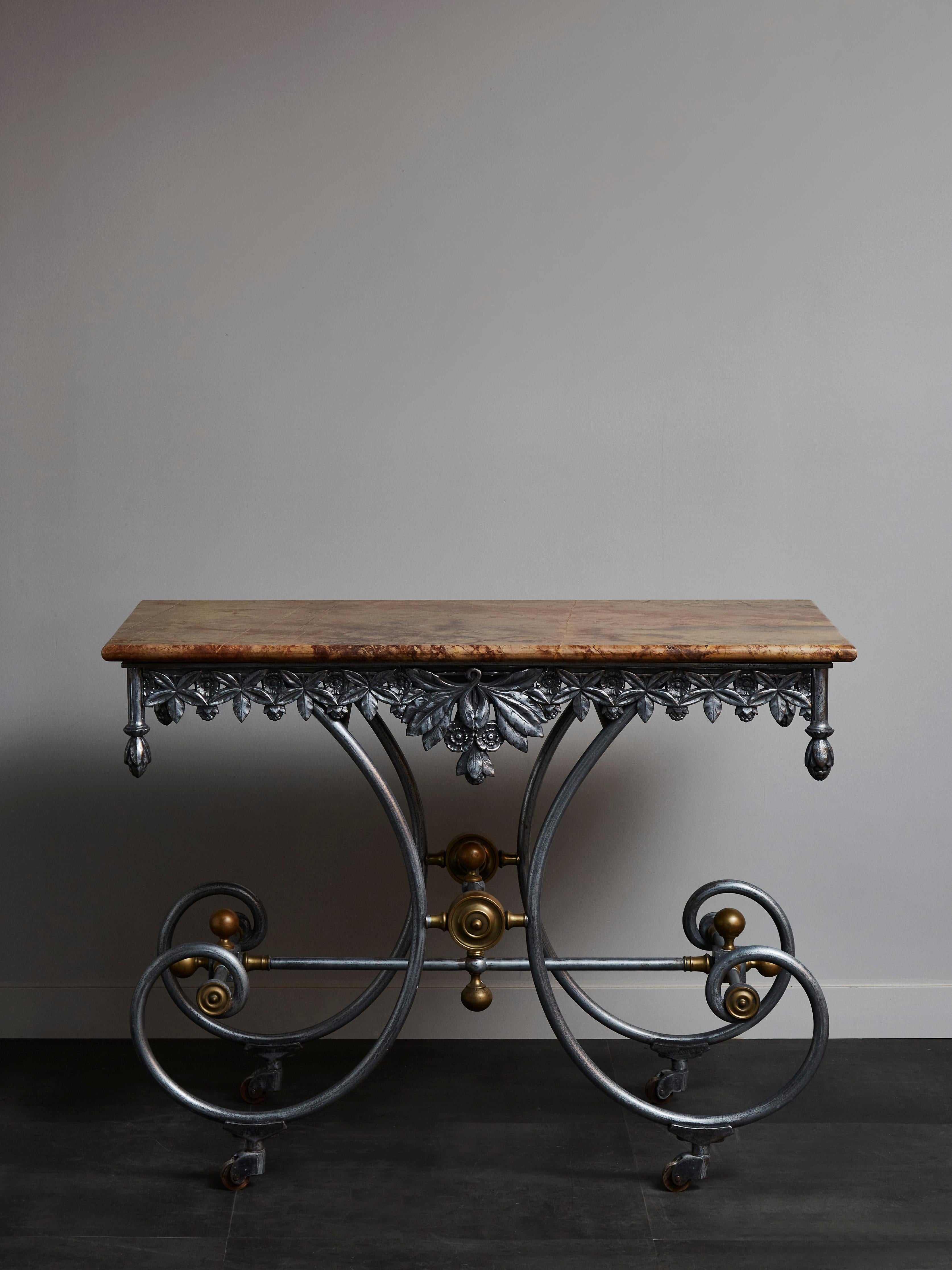 Old game table in steel, brass and marble top.
France, early 19th century.
 