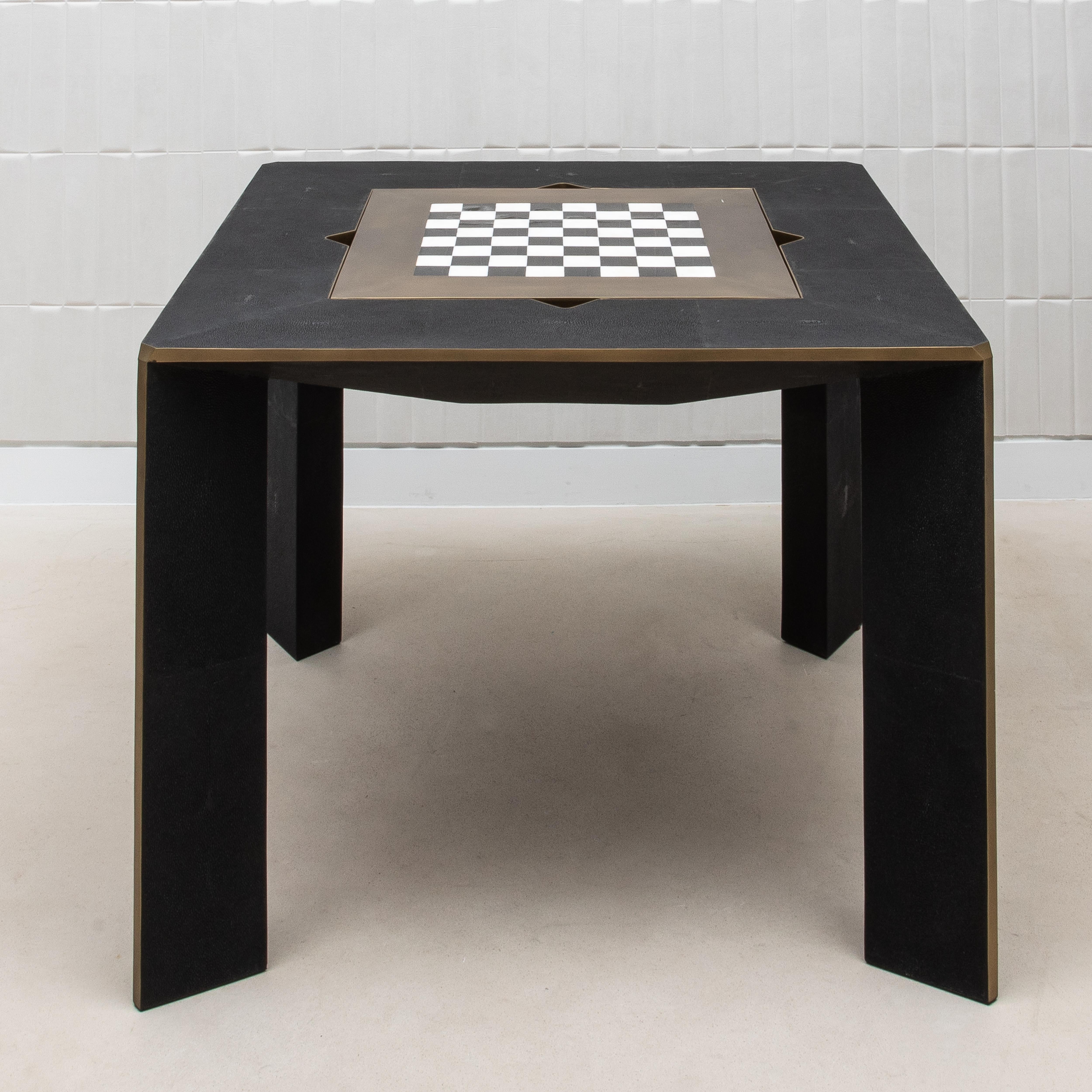 The Parsons Game Table by R&Y Augousti is an exquisite fusion of form, function, and luxury, designed for those who appreciate the finer things in life. This handcrafted masterpiece is wrapped in sumptuous black shagreen, a material revered for its