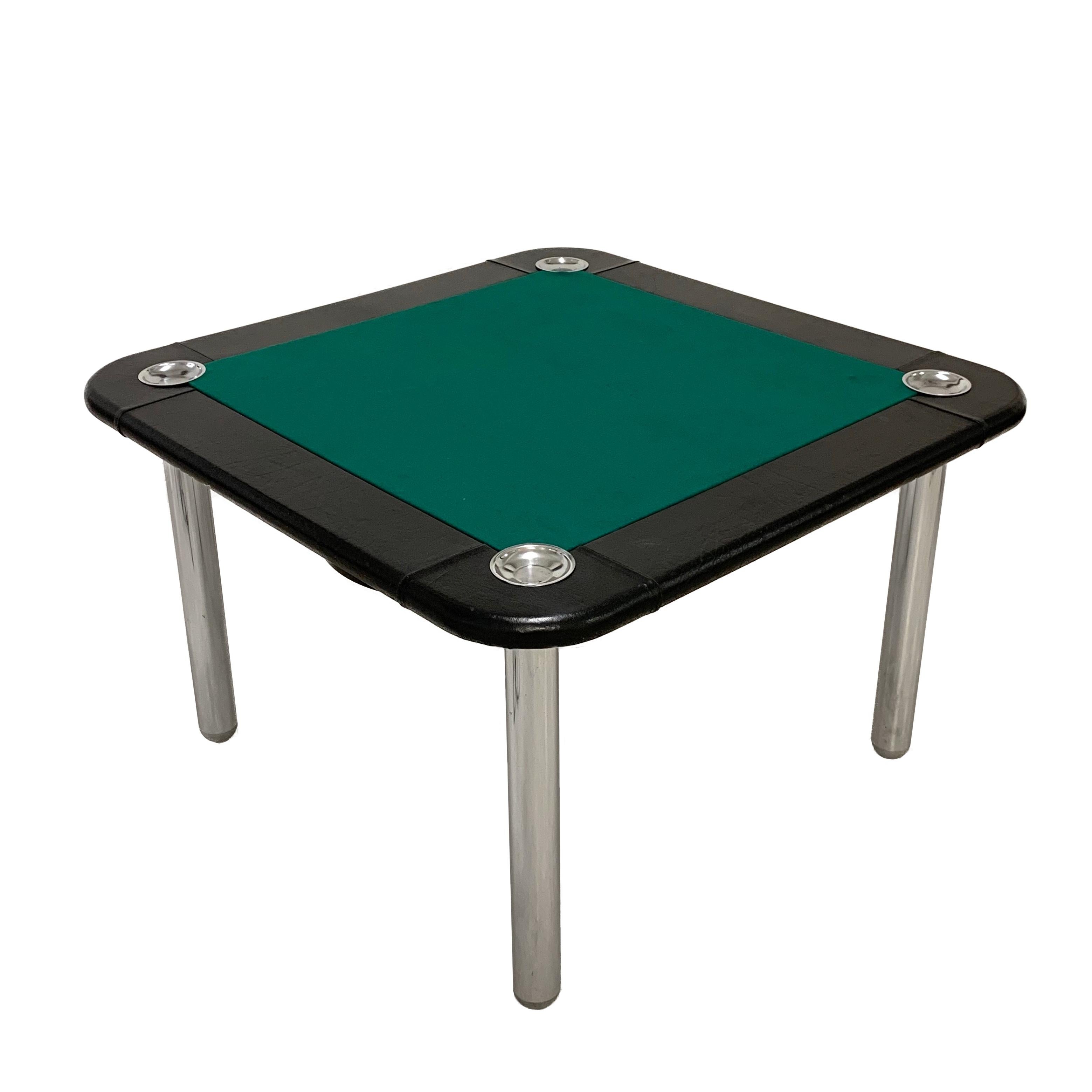 This large gaming table attributable to Zanotta S.p.A., Italy. The top is in new green fabric, black leather edges and four ashtrays. The tubular legs are made of stainless steel with black plastic tops. The table is complete with swivel ashtrays