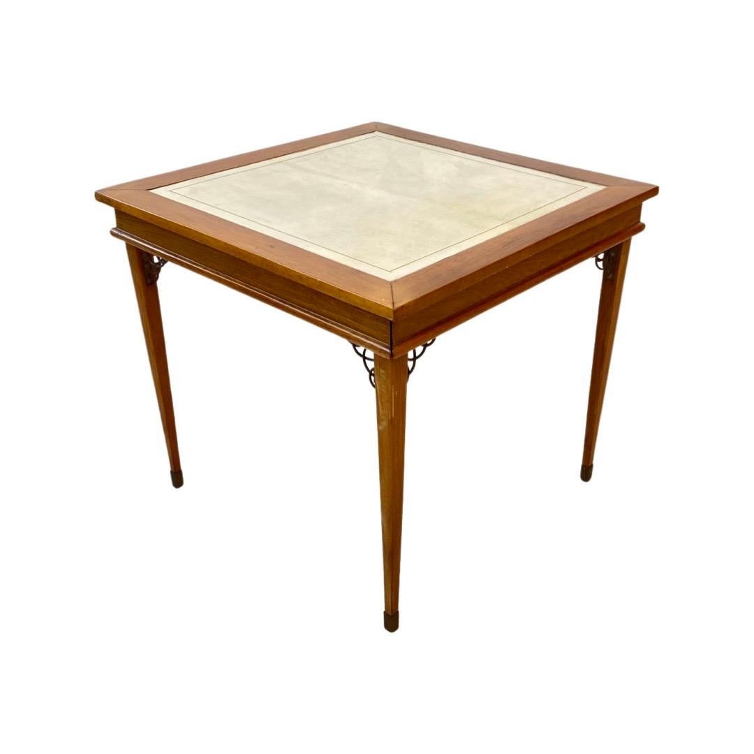 An important Art Deco game table set (includes 4 chairs) in Oak Wood (table) and Cherry Wood ( chairs) with a Goat Skin top. Designed by Jacque Adnet. 

Jacques Adnet was an iconic Art Deco French designer. His designs featured clean lines, simple