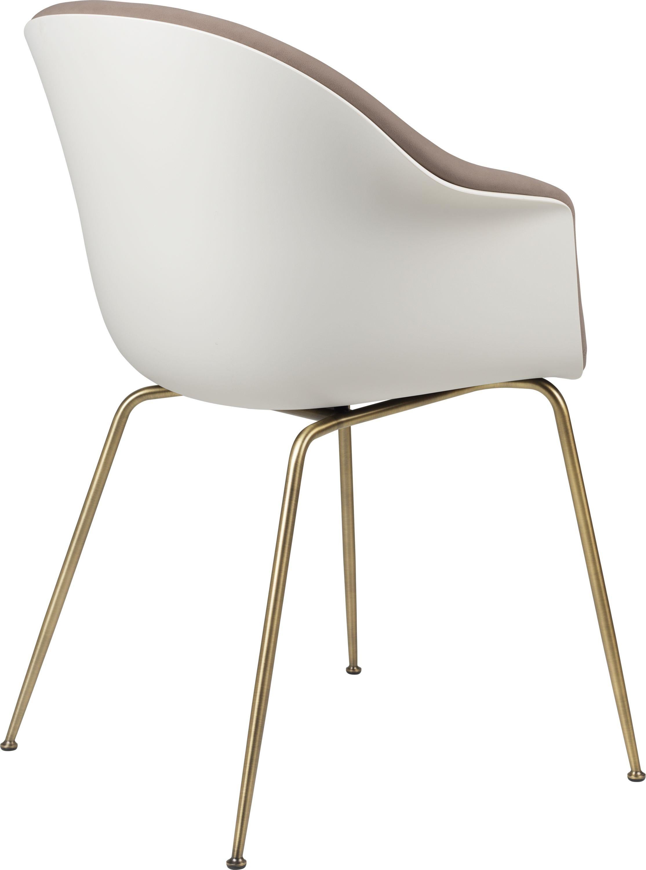 GamFratesi 'Bat' dining chair in brown and white with antique brass conic base. Designed by Danish-Italian design-duo GamFratesi in 2018, the Bat dining chair is created with a Scandinavian approach to crafts, simplicity, and functionalism. The