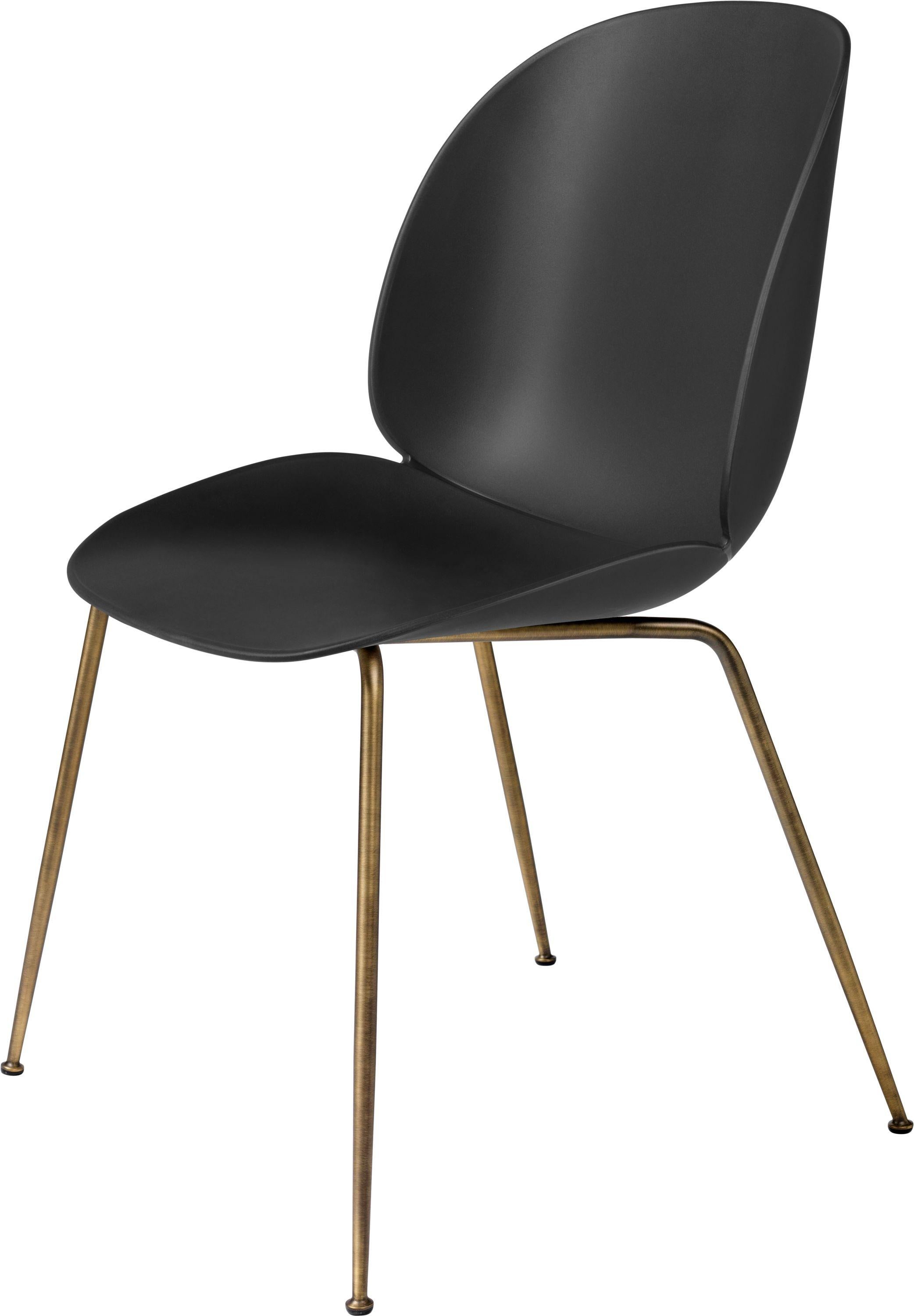 GamFratesi 'Beetle' dining chair with antique conic base. Designed by Danish-Italian design-duo GamFratesi in 2013. The Beetle chair’s durable outer shell is a continuous curved form reminiscent of the strong and graceful contours of the insect that