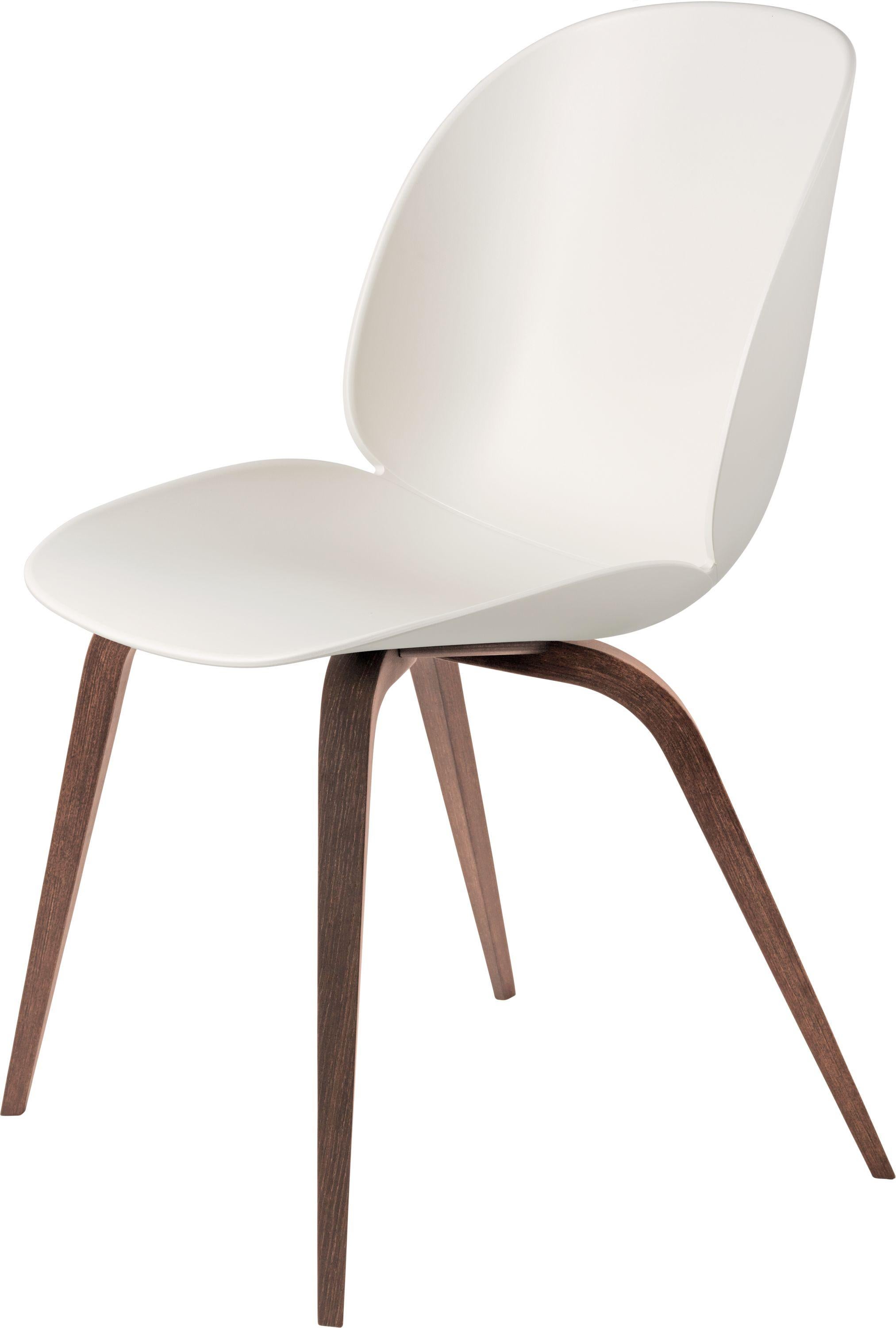 GamFratesi 'Beetle' dining chair with walnut conic base. Designed by Danish-Italian design-duo GamFratesi in 2013. The Beetle Chair’s durable outer shell is a continuous curved form reminiscent of the strong and graceful contours of the insect that