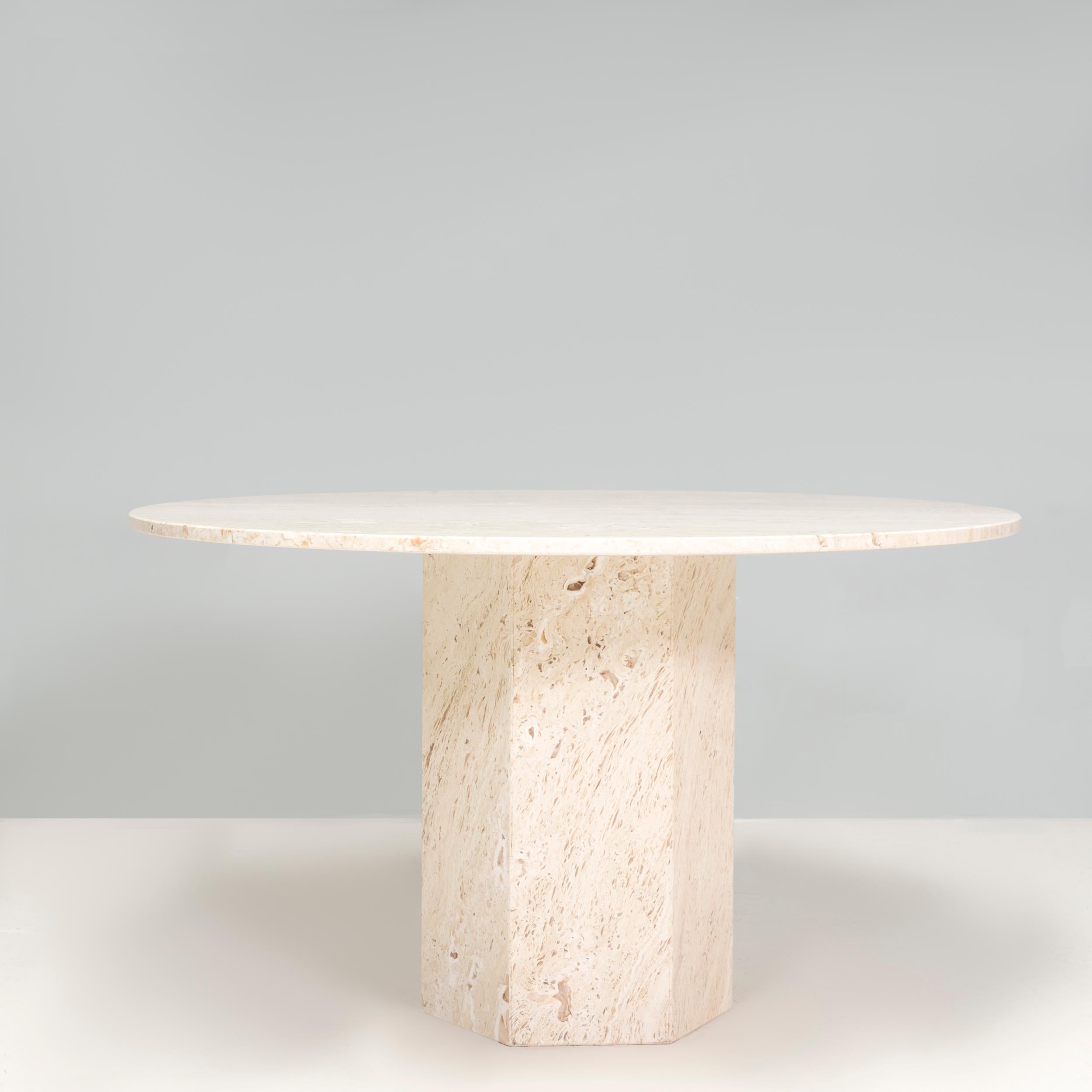 Originally designed in 2020 by GamFratesi for Gubi, the Epic dining table is inspired by ancient Greek columns and Roman architecture.  Constructed completely from natural white travertine, the dining table features a hexagonal column base, balanced