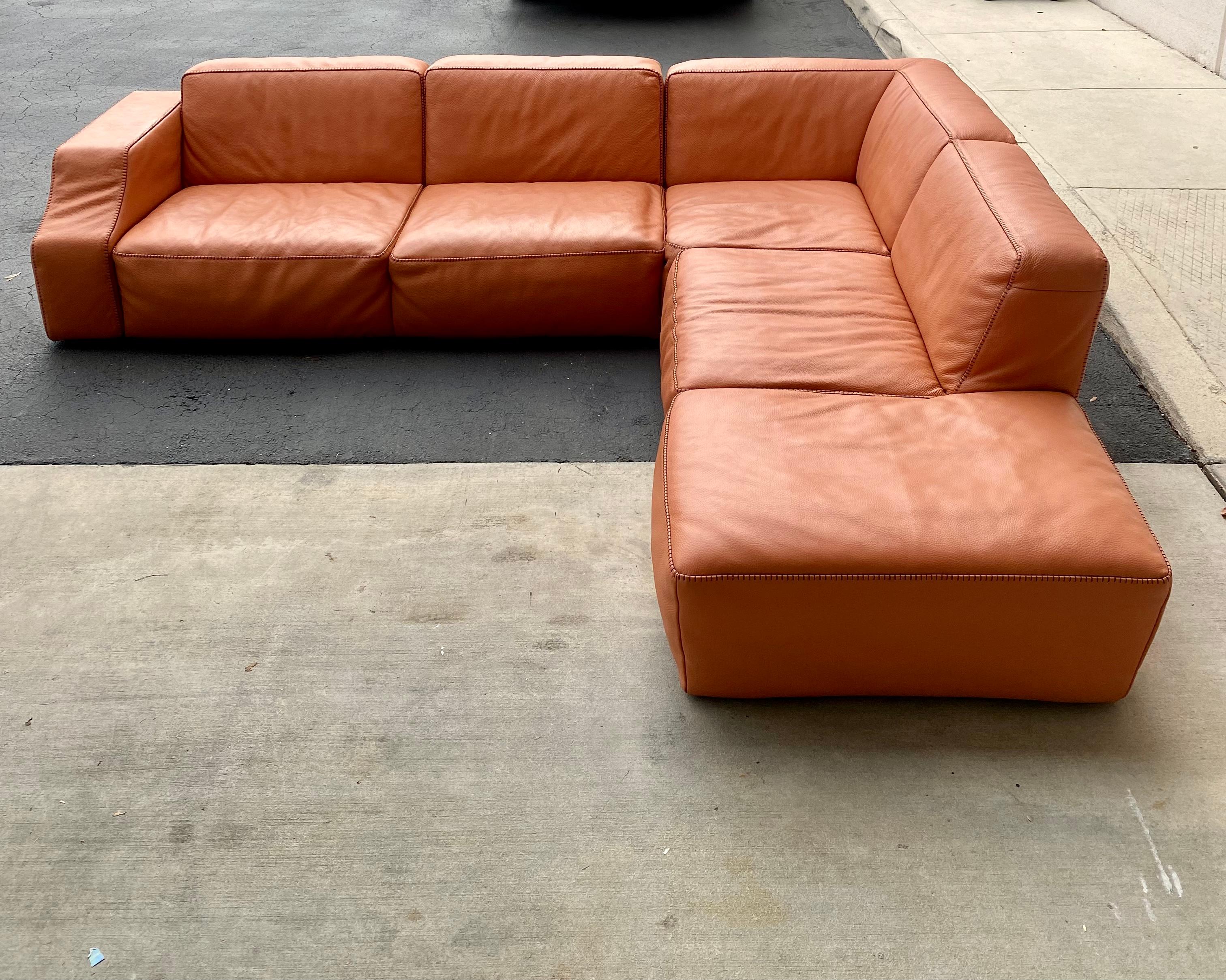 Perpetually trendy with angular lines that are starkly contrasted against the shapely, curved armrests, the Oxer corner sectional sofa with peninsula is an ideal choice for modern areas. Manufactured in Italy by Gamma Arredamenti, the sectional is a