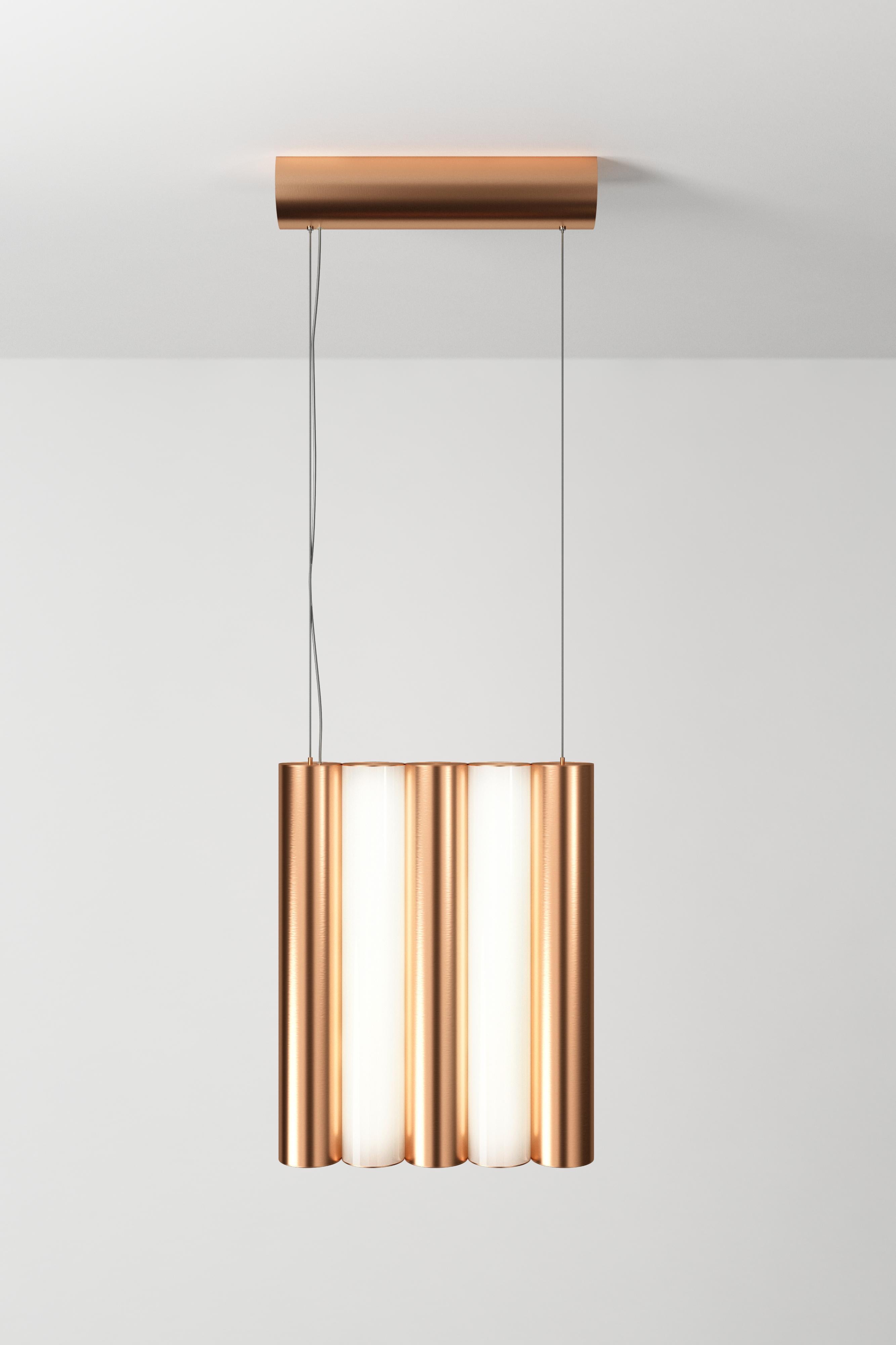Gamma L5 copper pendant by Sylvain Willenz
Dimensions: D 25 x W 5 X H 42.3 cm
Materials: solid brass, white polycarbonate diffuser, metal cable and transparent electric cable.
Others finishes and dimensions are available. 

All our lamps can be