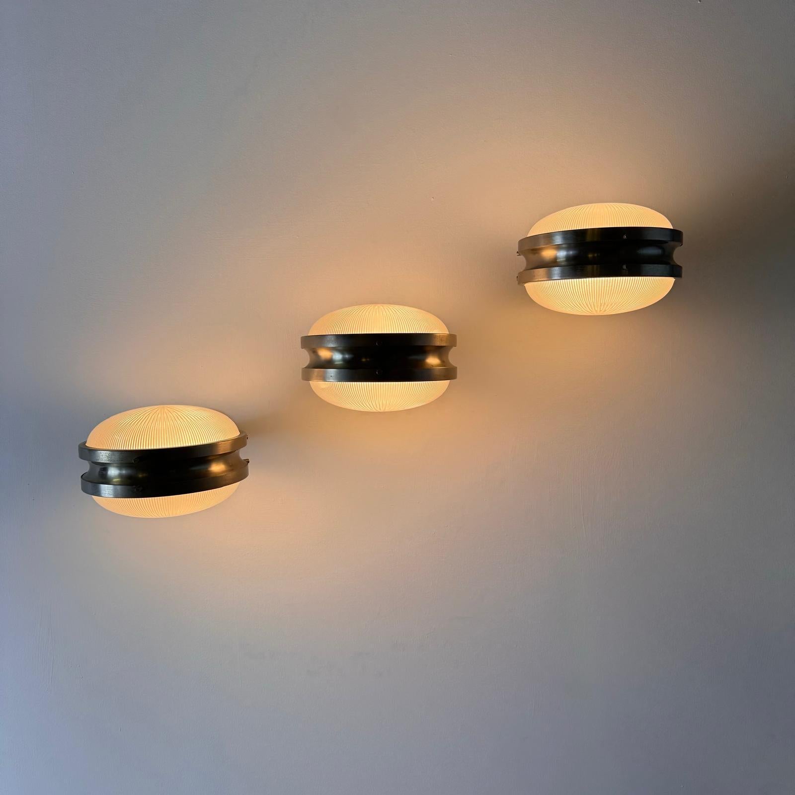 Set of 3 conces model Gamma molded glass and nickel-plated brass frame production Artemide 1960s designer Sergio Mazza. Artemide is a company specializing in the production of lighting accessories (lamps, chandeliers, lighting points), founded by