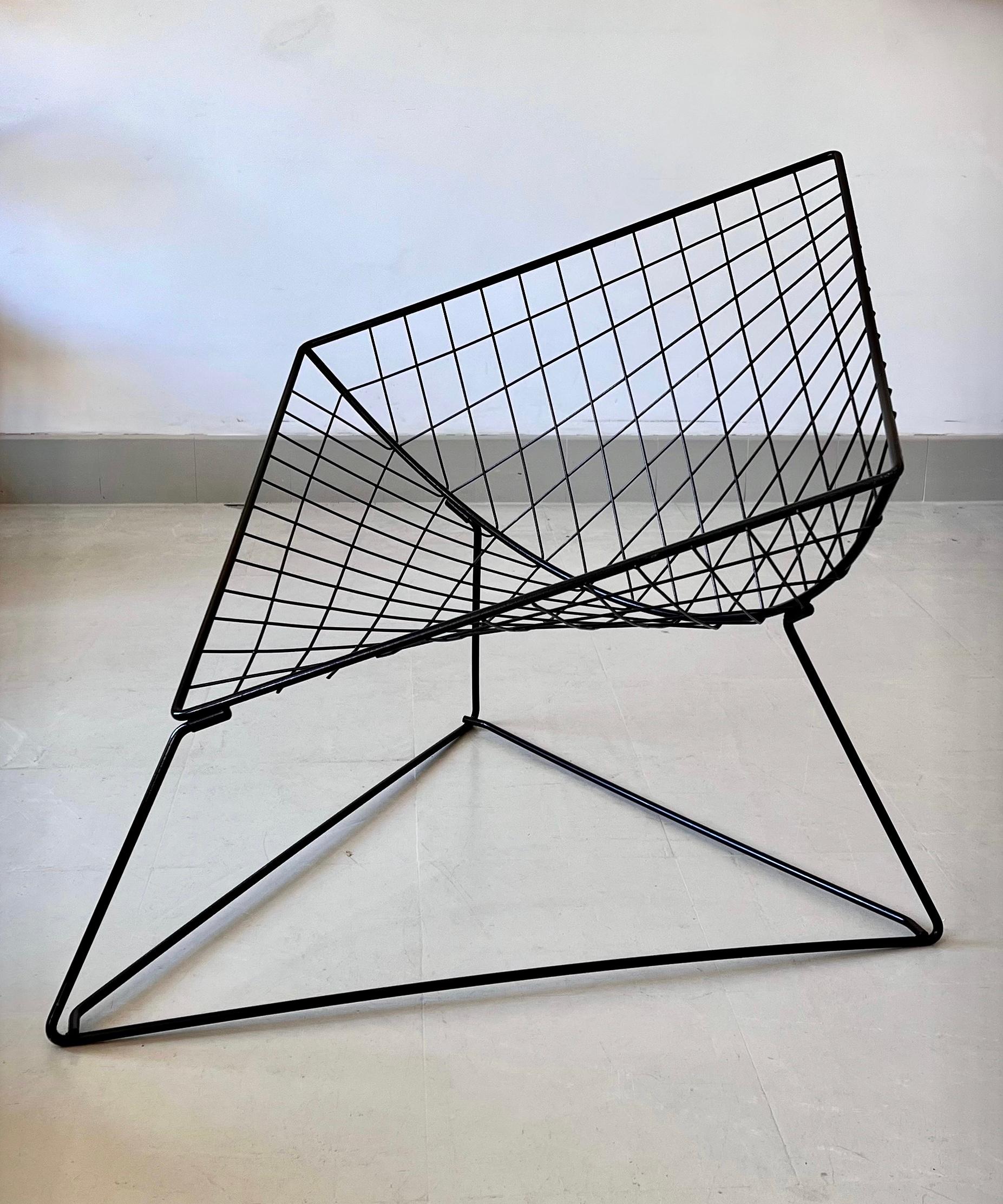 Tubular steel armchair created by the Danish designer Niels Gammelgaard for IKEA. 
An iconic piece, a real classic in Danish design. in very good condition. 
The lacquered metal structure forms a diamond placed on a triangular. The perspective