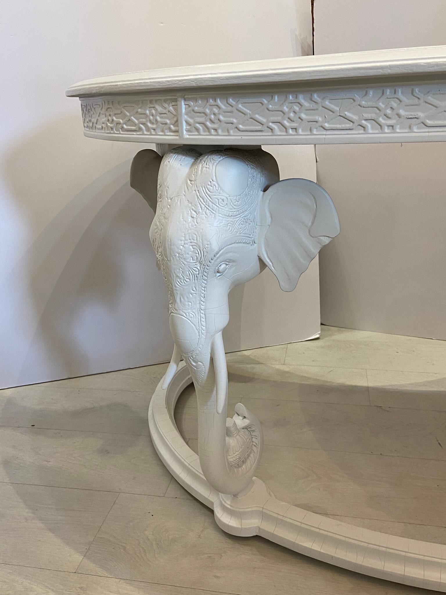 A vintage Gampel and Stoll kidney shaped elephant desk with one drawer. I know it’s Fretwork border around the top of the desk. The desk has been 100% restored and has new satin white lacquer. A functional whimsical desk with four elephants to get