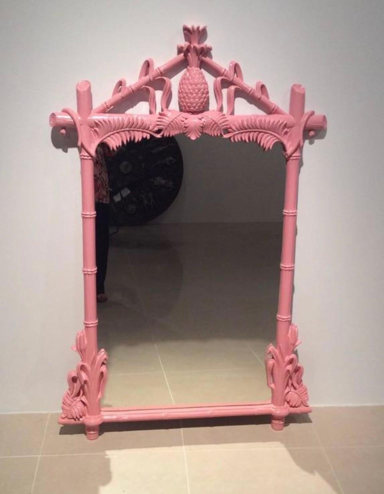 Vintage Gampel-Stoll faux bamboo pineapple large wall mirror. Lacquered in a perfect Palm Beach flamingo pink. Dimensions: 58 H x 38 W x 3 D.