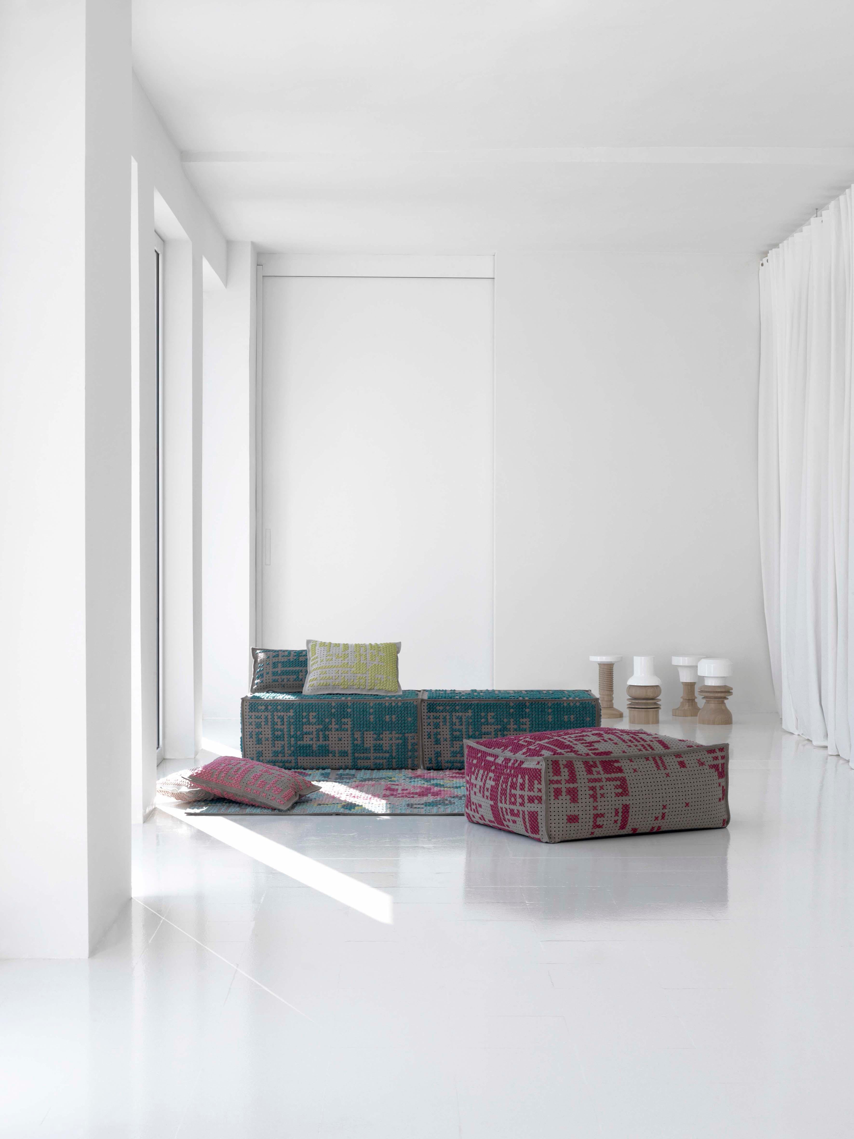 Charlotte Lancelot revisits a classic technique: a cross, a pixel. Carpets, poufs and cushions made using a perforated soft felt base with interwoven threads of wool in a range of colors. 

Additional Information:
Material: Wood frame and 30kg