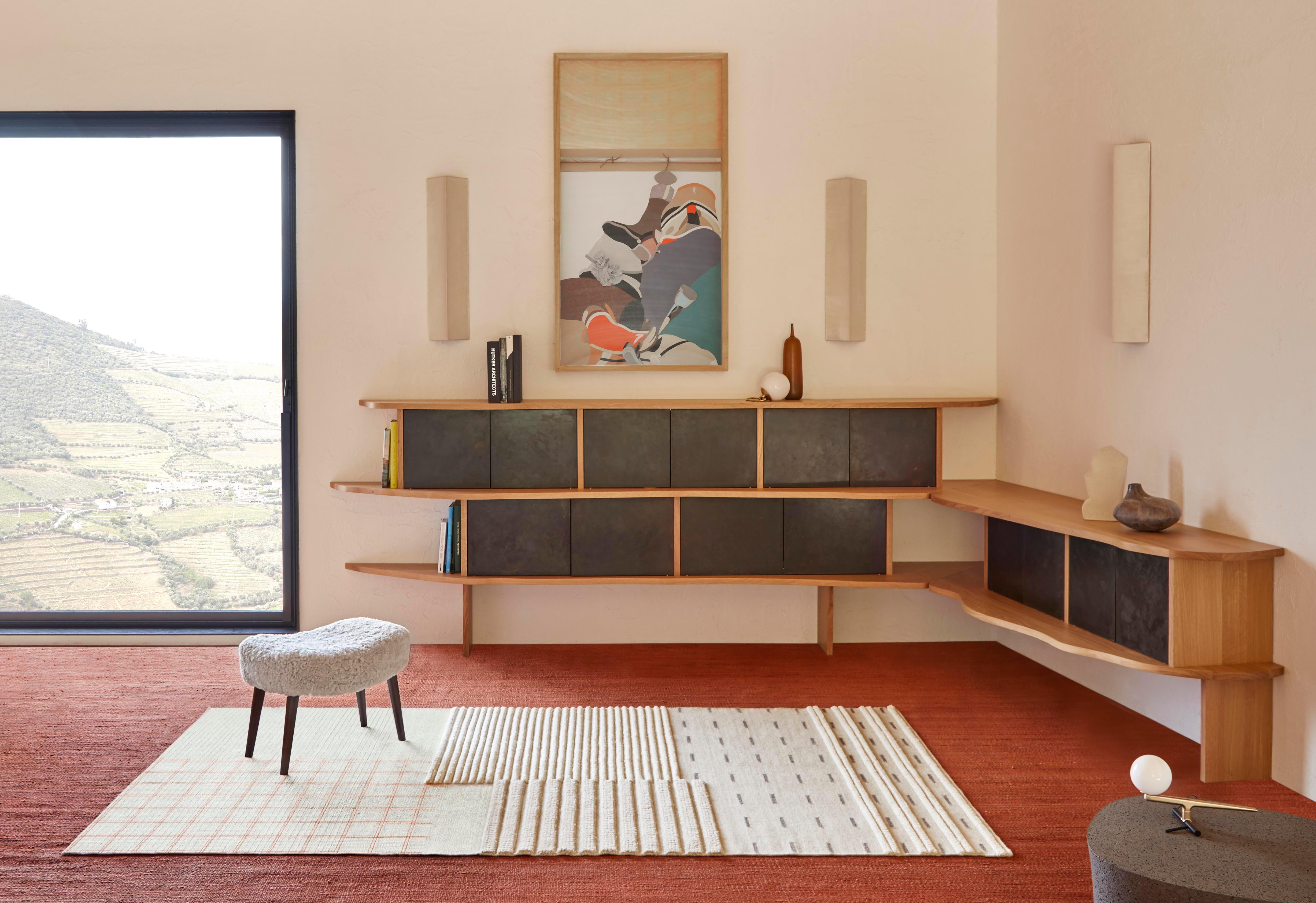 “Neri&Hu questions the sofa typology. Once the normal typology of a piece of furniture is broken down into its components, seating and rug become a single space.

The back component draws from the origins of GAN as a textile brand, by referencing