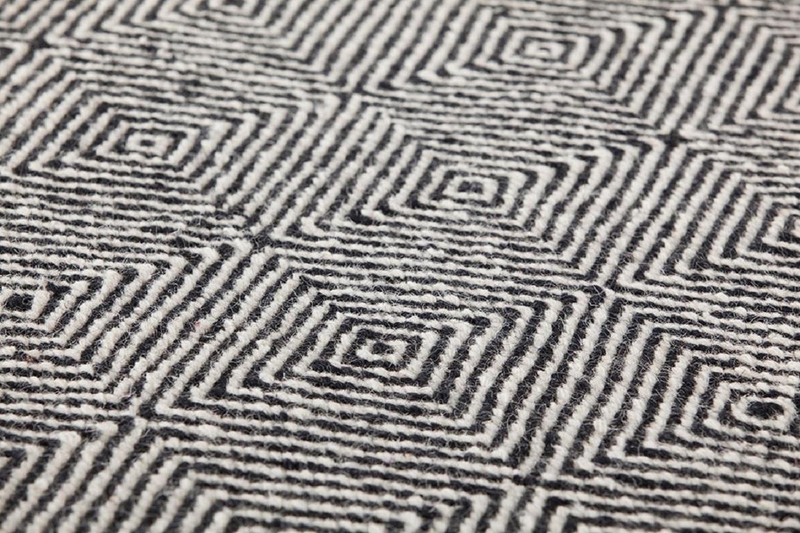 Dhurrie wool is transformed and grows in volume. Urban, sober and essential, it reveals myriad new possibilities. 

Additional information:
Material: Jute. 100% wool. Reversible
Color: Black
Technique: Dhurrie
Dimensions: 67 W x 95 D x 0.39 H
