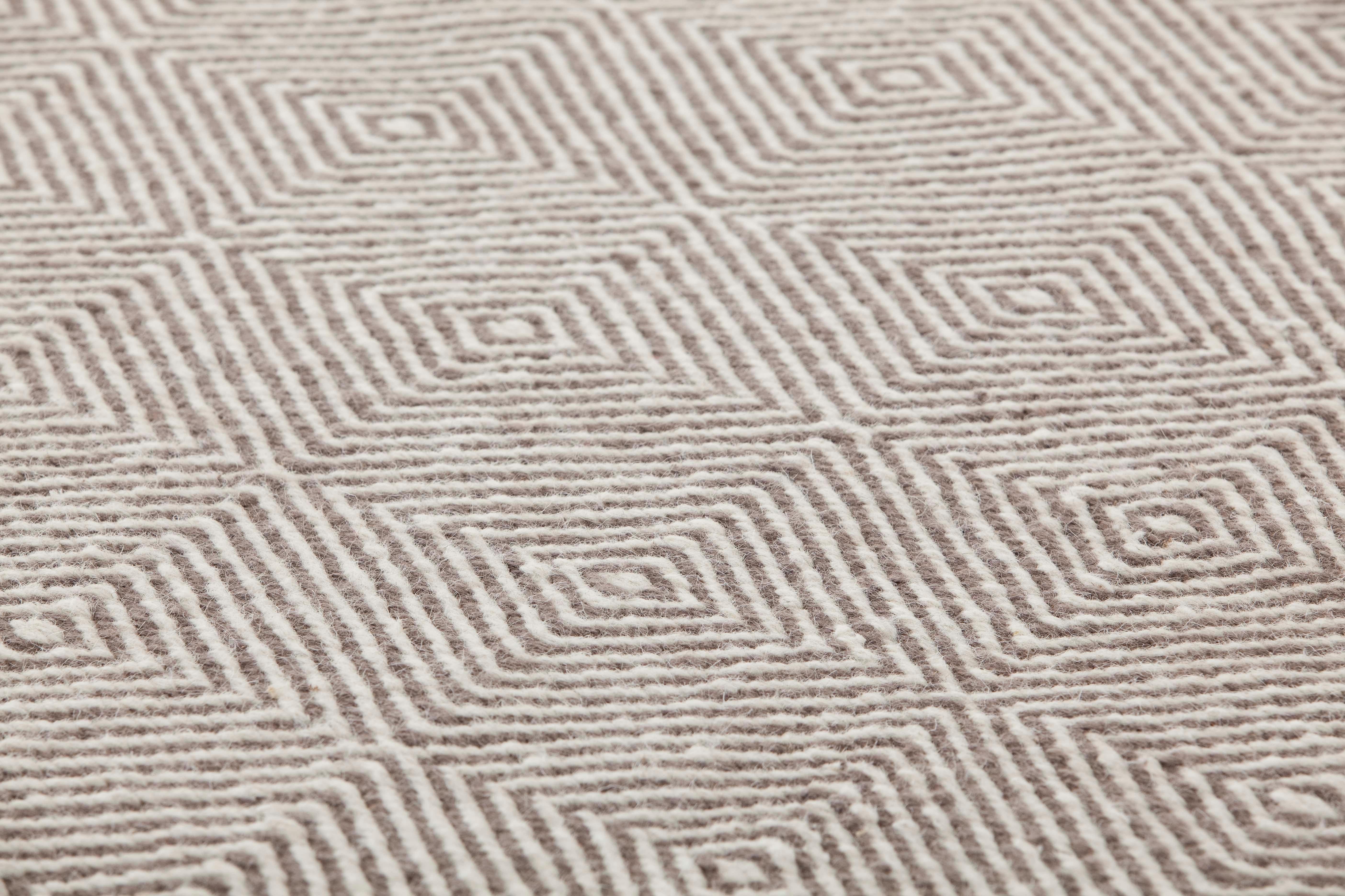 Dhurrie wool is transformed and grows in volume. Urban, sober and essential, it reveals myriad new possibilities. 

Additional information:
Material: Jute. 100% wool. Reversible
Color: Taupe
Technique: Dhurrie
Dimensions: 59 W x 79 D x 0.39 H