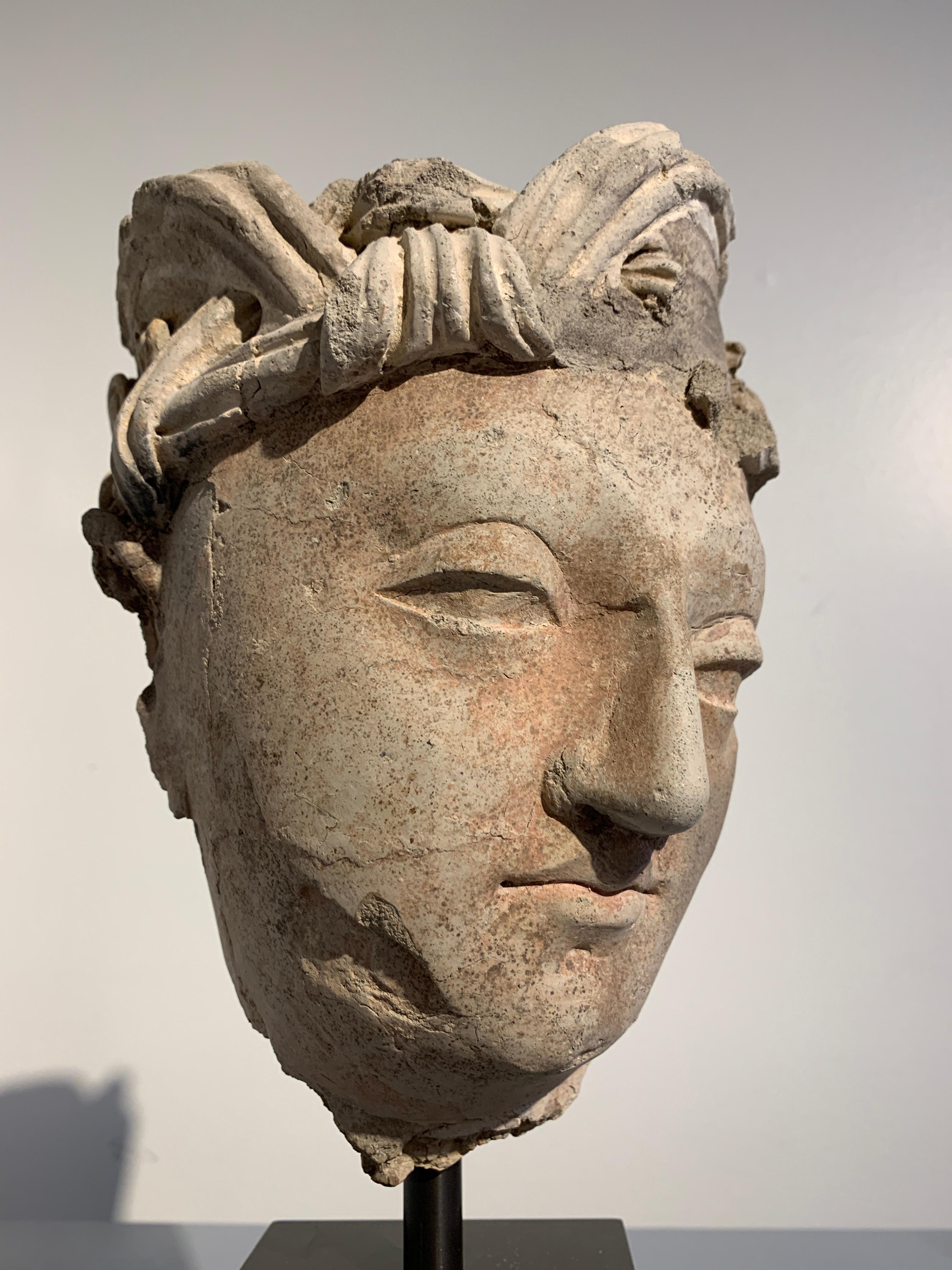 18th Century and Earlier Gandharan Stucco Head of a Bodhisattva, Region of Hadda, 3rd-5th Century For Sale