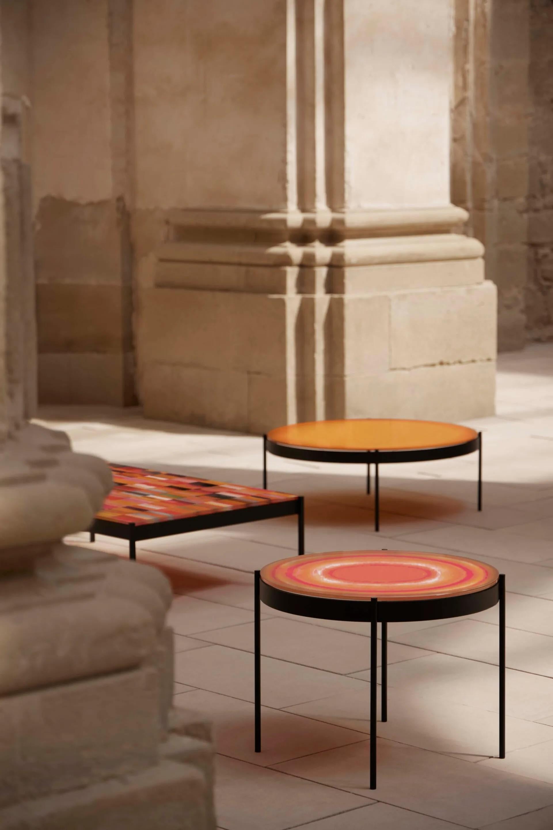 Outdoor Iris Coffee Table by Gandia Blasco, Warm Comporta Sunrise

The Iris Coffee Table by Alejandra Gandía-Blasco is a compelling example of outdoor furniture as functional art. This version features a sleek, black powder-coated aluminum base