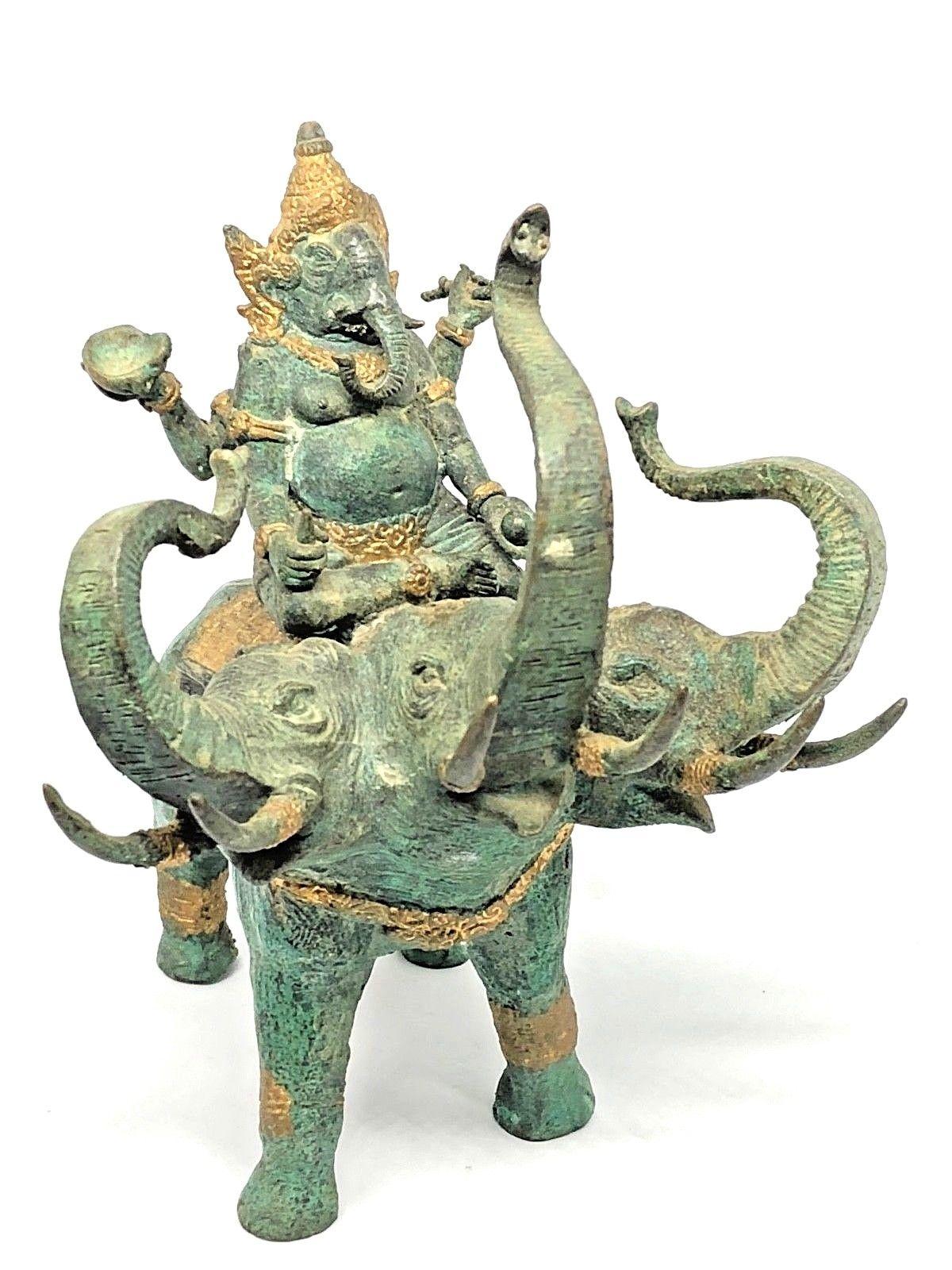 A decorative handmade elephant sculpture or statue. Some wear but this is old-age. Made of bronze. We think it is from Asia and was made in the mid-20th century.