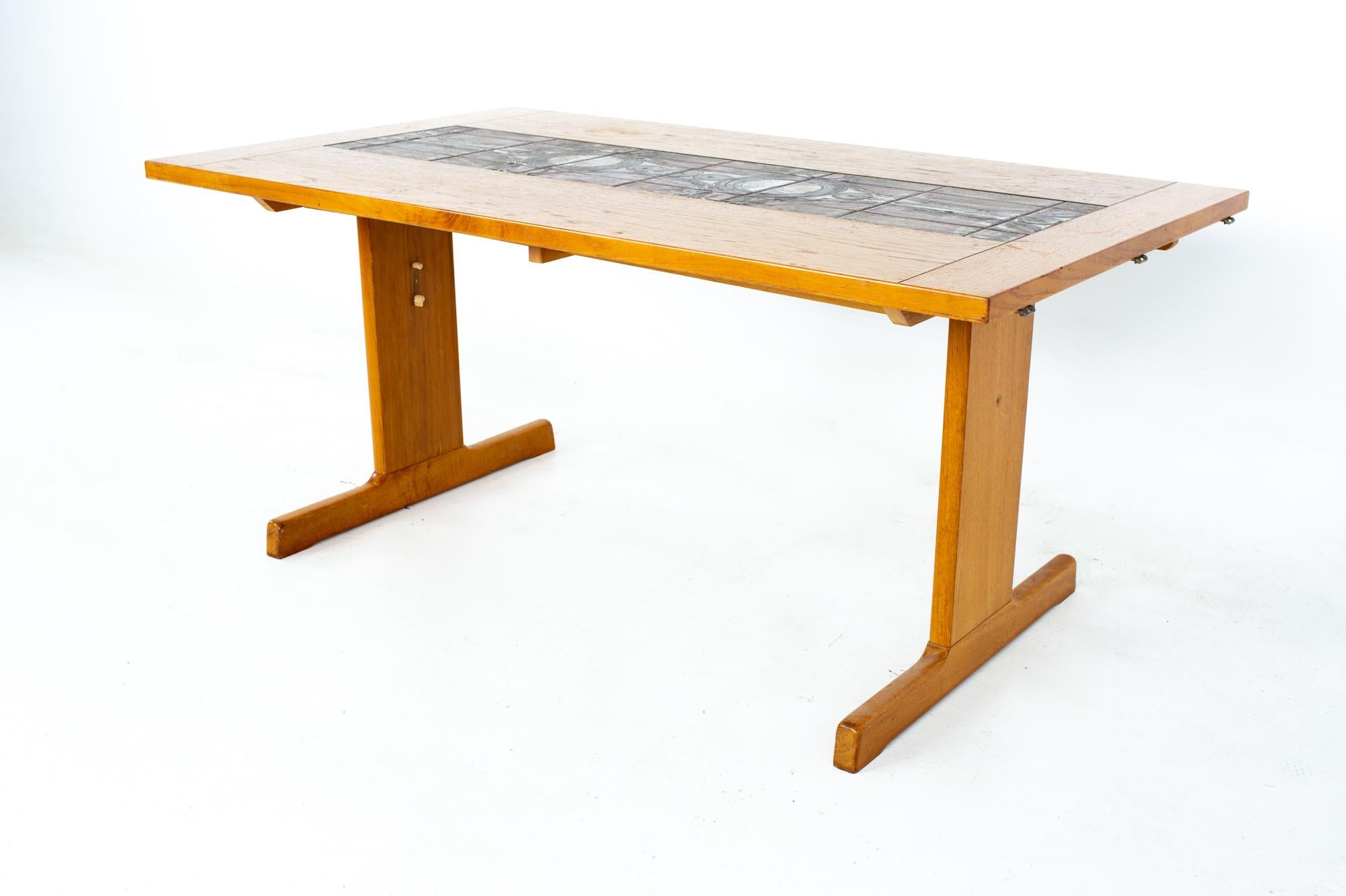 Gangso Mobler mid century teak tile top dropside dining table
Table measures: 62.5 wide x 36 deep x 28.5 inches high; each leaf is 18 inches wide, making maximum table width of 98.5 inches when both leaves are used 

All pieces of furniture can