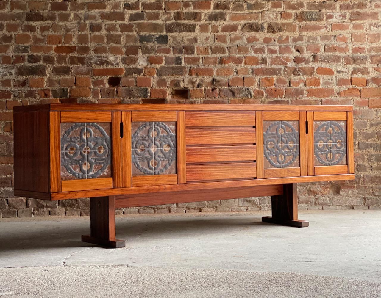 Gangso Mobler rosewood sideboard Poul H. Poulsen, Denmark, circa 1978

Rare and exceptional 7ft Poul H. Poulsen for Gangsø Møbler solid rosewood sideboard credenza circa 1970s, with large ceramic tile fronted doors with soft earthy 1970s color