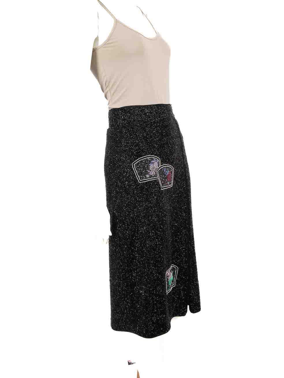 CONDITION is Never worn, with tags. No visible wear to skirt is evident on this new Ganni designer resale item.
 
 Details
 Black
 Polyester
 Pencil skirt
 Beaded
 Beaded patch detail
 Midi
 Side zip fastening
 
 
 Made in India
 
 Composition
 100%