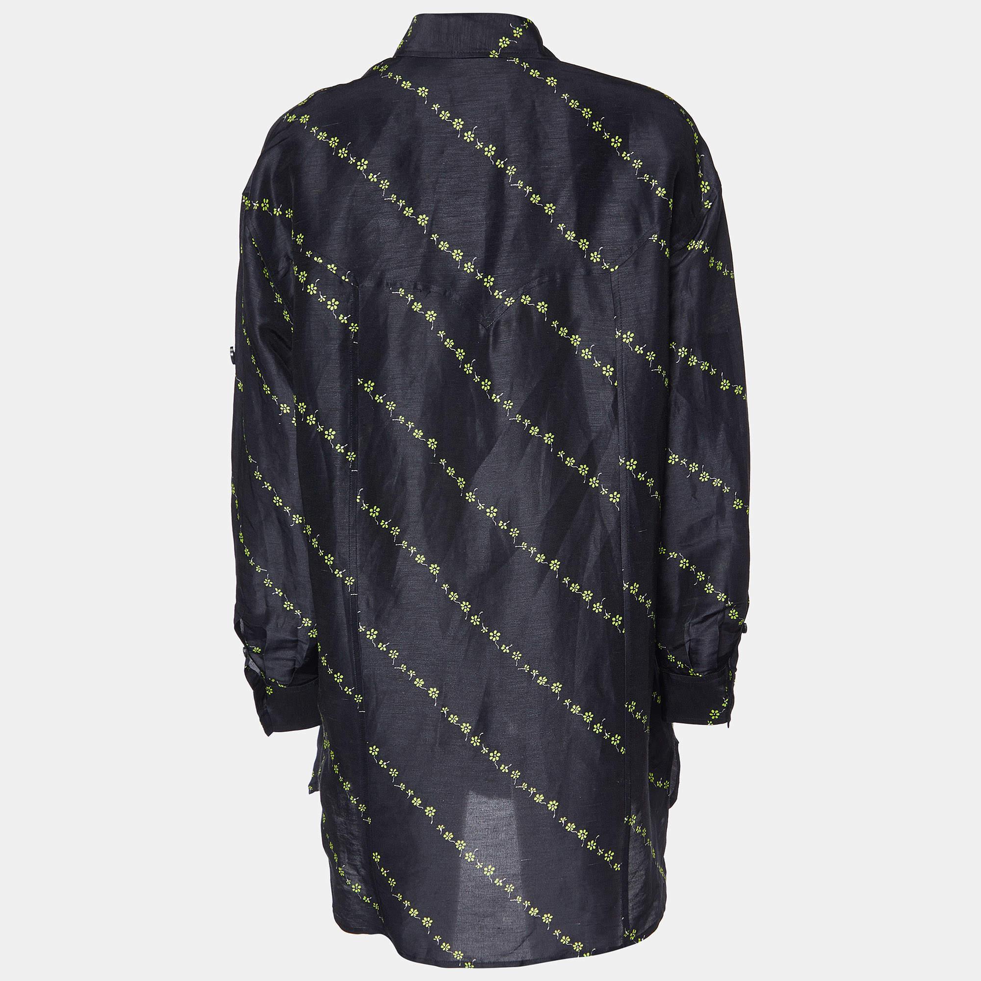 This stunning shirt by Ganni is a closet must-have, Crafted from linen and silk, it features a lovely black floral print throughout. The sheer shirt features long sleeves.. It exudes sophistication and is a great option for formal occasions.