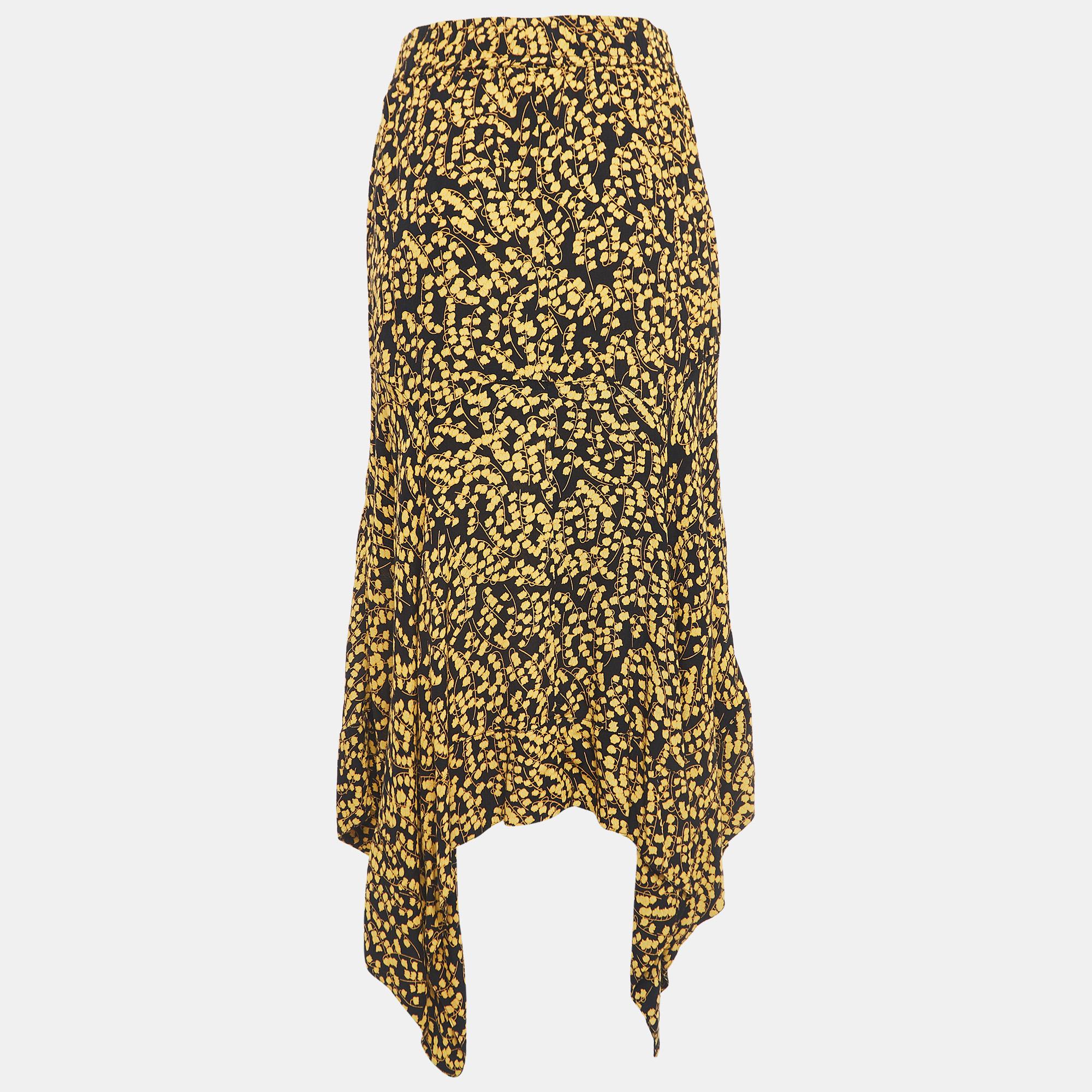 The Ganni skirt exudes effortless chic with its vibrant floral pattern. Crafted from high-quality crepe fabric, the skirt boasts an asymmetrical silhouette that adds a playful edge to any ensemble. Elevate your style with this versatile and