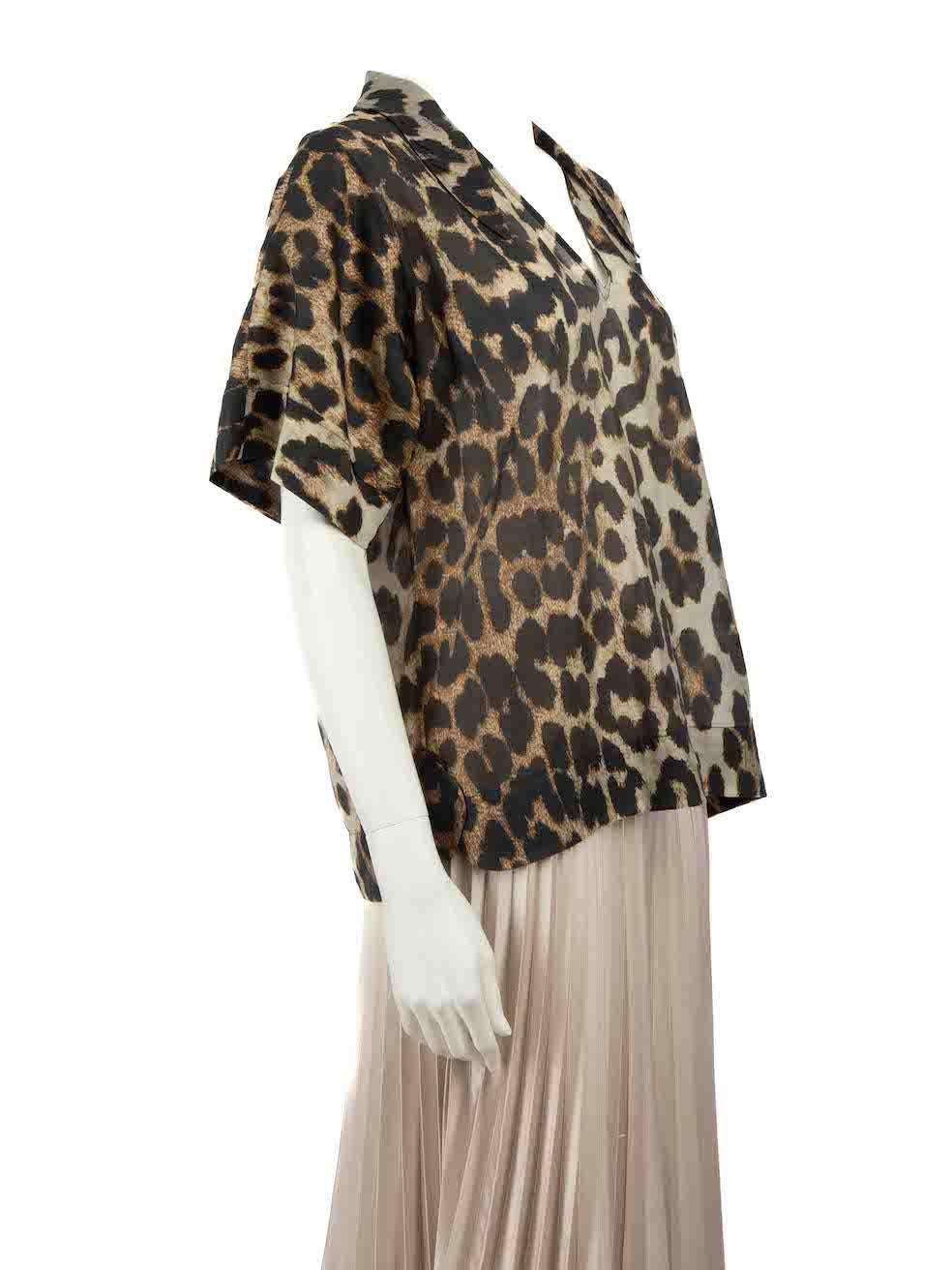 CONDITION is Very good. Hardly any visible wear to top is evident on this used Ganni designer resale item.
 
 Details
 Brown
 Synthetic
 Top
 Leopard print
 Short sleeves
 V-neck
 Sheer
 
 
 Made in China
 
 Composition
 85% Lyocell tencel, 15%
