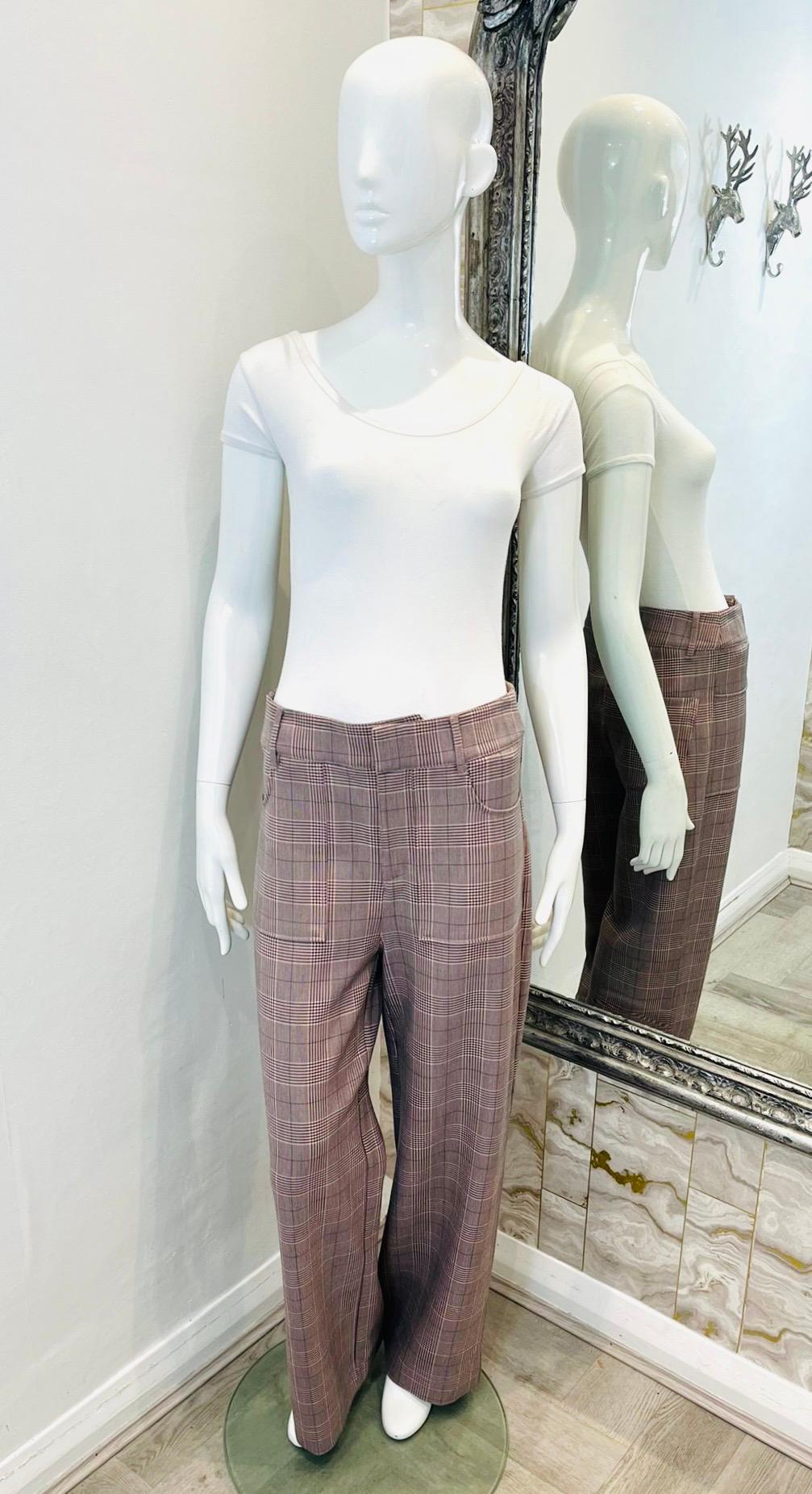 Ganni Checked Cady Trousers

Dusty pink trousers designed with check pattern and loose, straight-leg silhouette.

Detailed with oversized front pockets, belt loops and hooks and zip closure. Rrp £200

Size – 36FR

Condition – Very Good

Composition