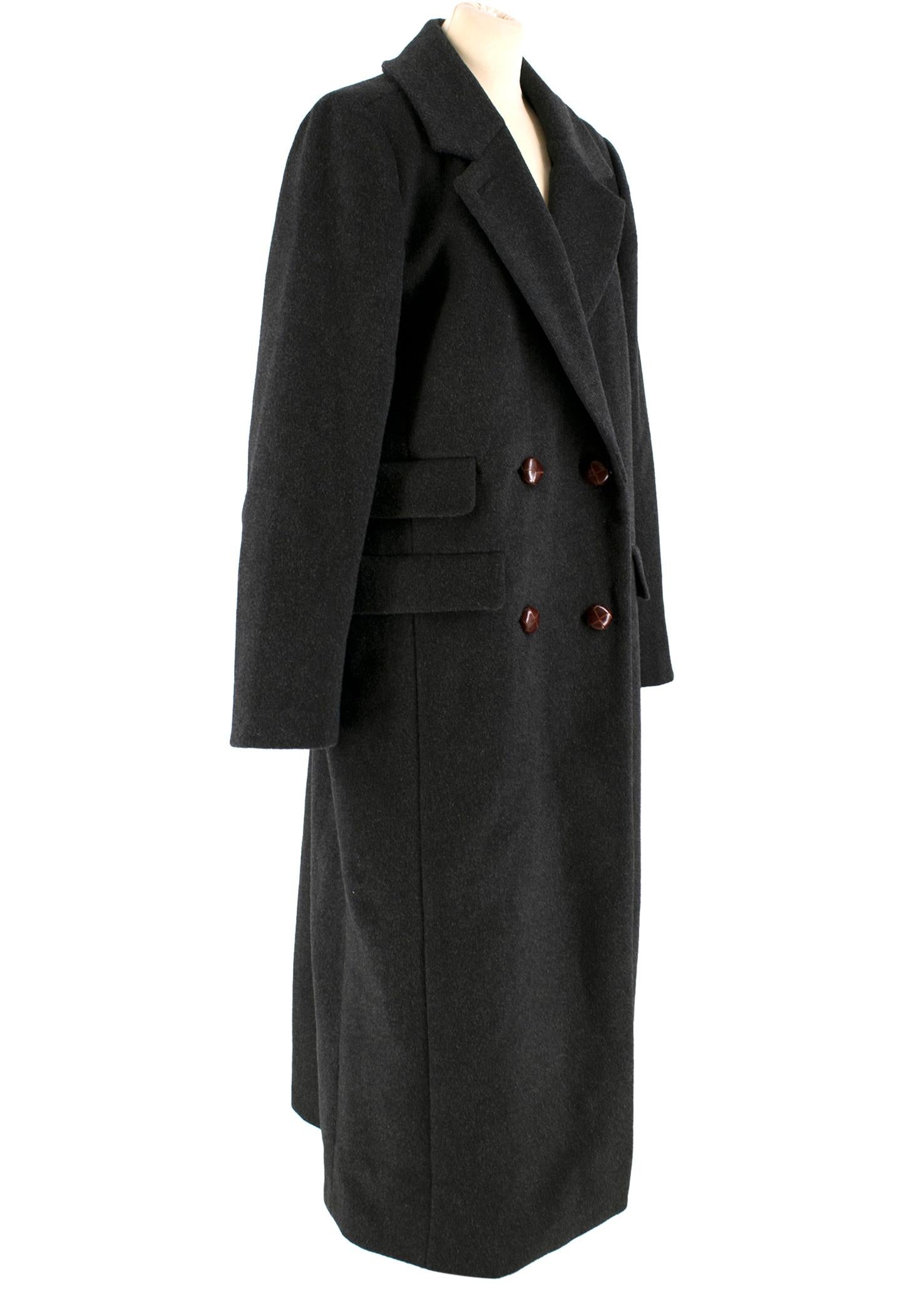 Ganni Dark-Grey Double-Breasted Long Wool Coat 

- Dark-Grey, wool long coat
- Double-breasted closure
- Woven-effect leather buttons
- Long sleeves
- Decorative flap buttons 
- Back vent

Please note, these items are pre-owned and may show some