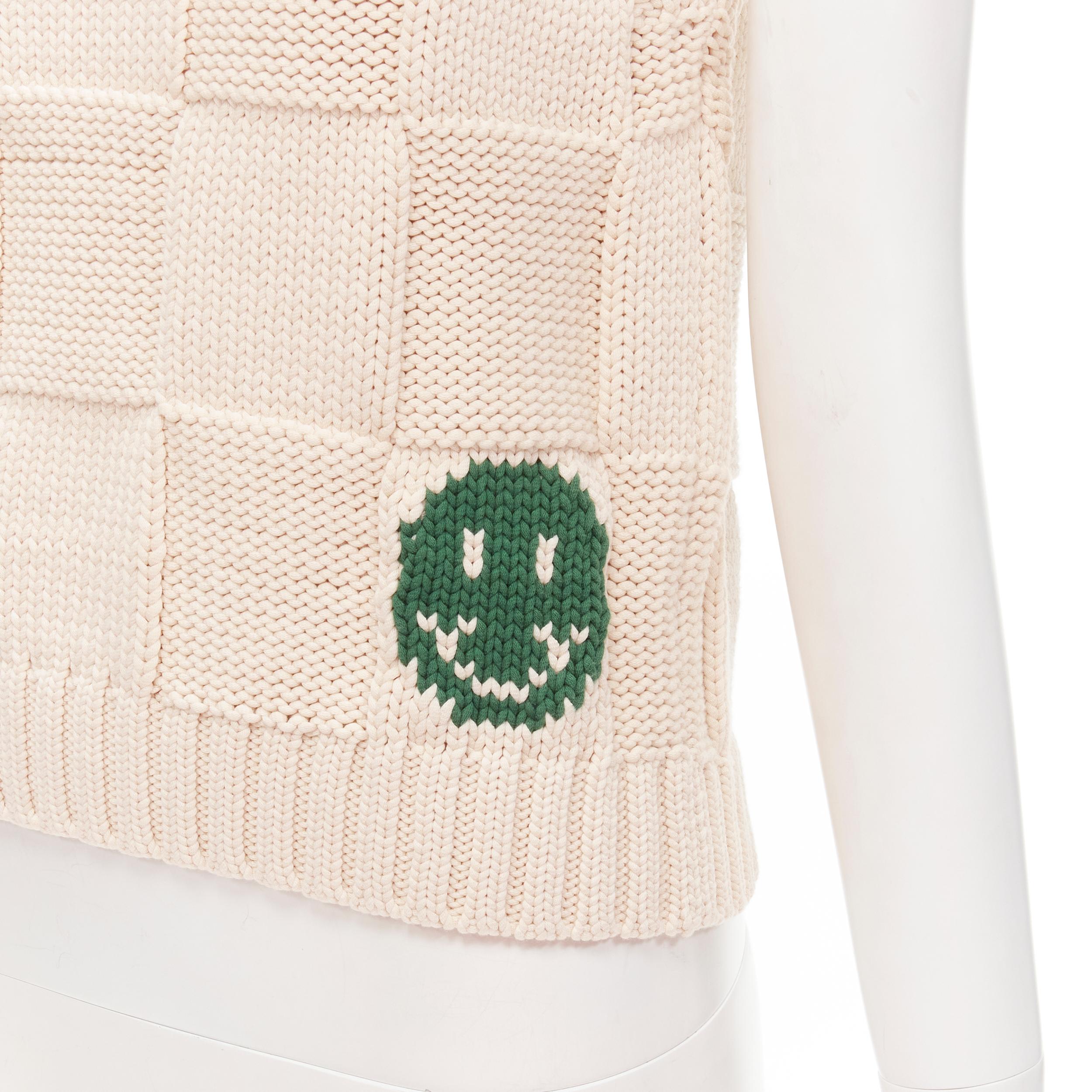 GANNI green smiley face checkered weave sleeveless vest XS 
Reference: ANWU/A00418 
Brand: Ganni 
Material: Wool 
Color: Beige 
Pattern: Solid 
Extra Detail: Button at shoulder. Green smiley face knitted at front hem. 

CONDITION: 
Condition: