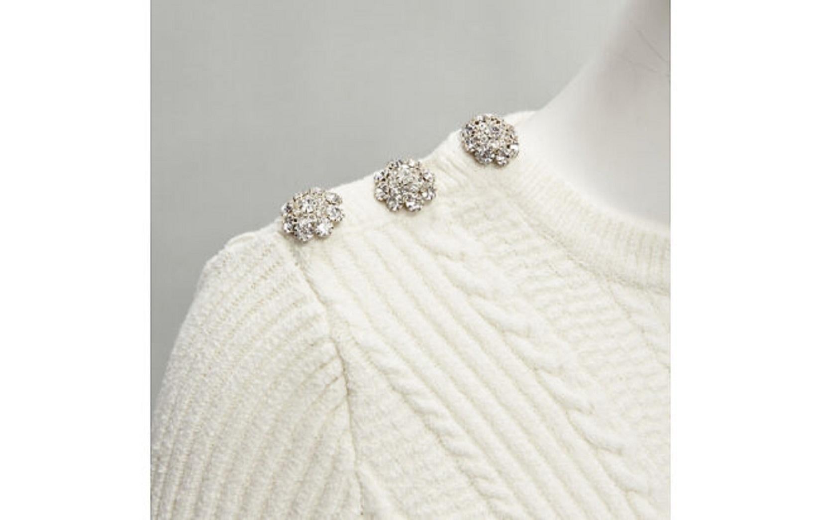 GANNI ivory crystal button textured knit cotton blend sweater top XS
Reference: AAWC/A00227
Brand: Ganni
Material: Cotton, Blend
Color: Ivory
Pattern: Knitted
Extra Details: Crystal buttons on right shoulder.
Made in: China

CONDITION:
Condition:
